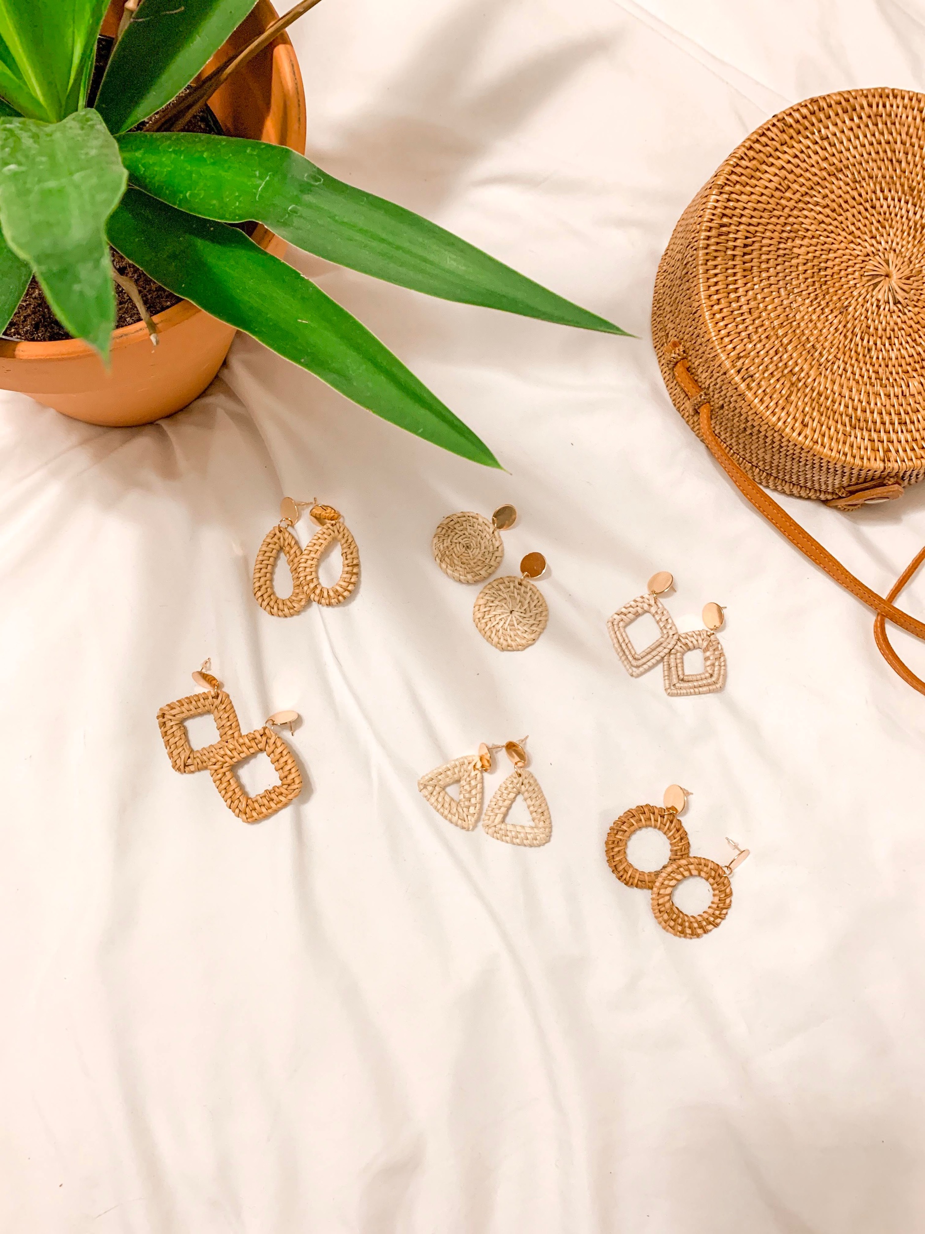 Six sets of rattan seagrass earrings for $13! They have gold posts and all come in different colors and styles. The perfect summer accessory!