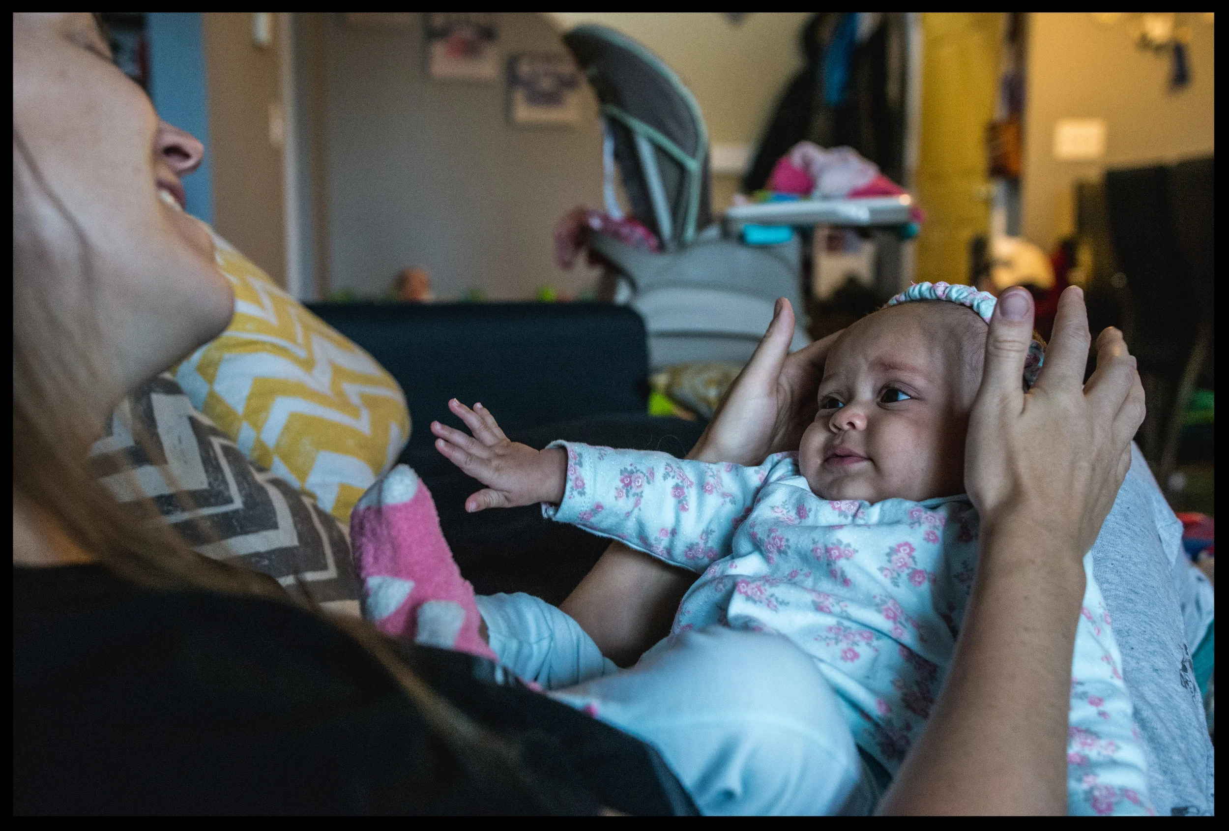 Mommy with baby girl on her lap, color, Aurora, Colorado