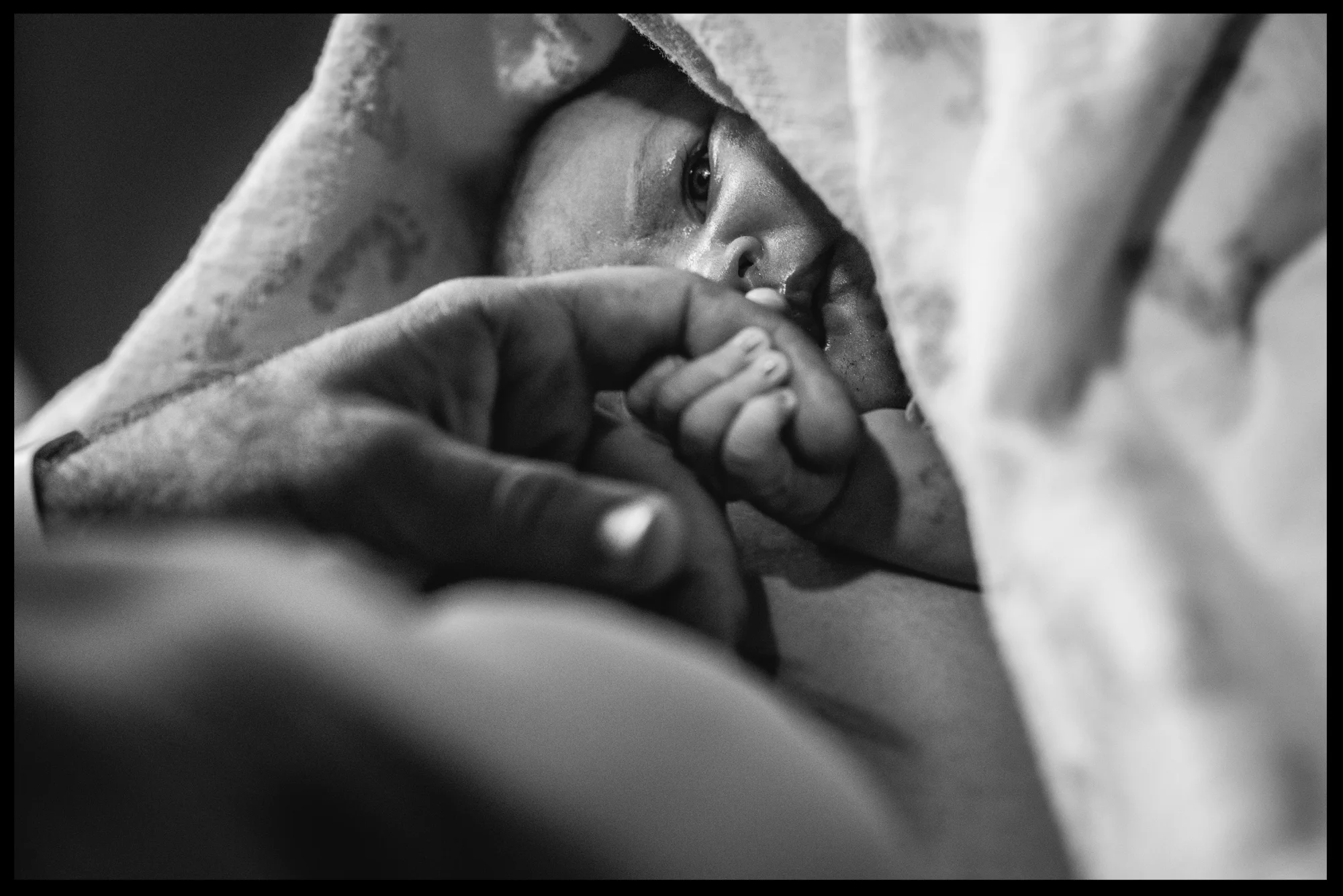 New baby girl holds her daddy's hand, black and white, Stillwater, OK