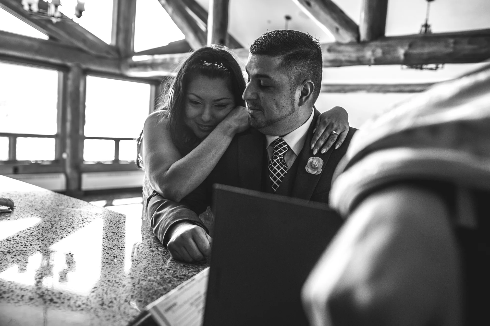 Bride leans on her new husband and smiles, Estes Park, Colorado, black and white