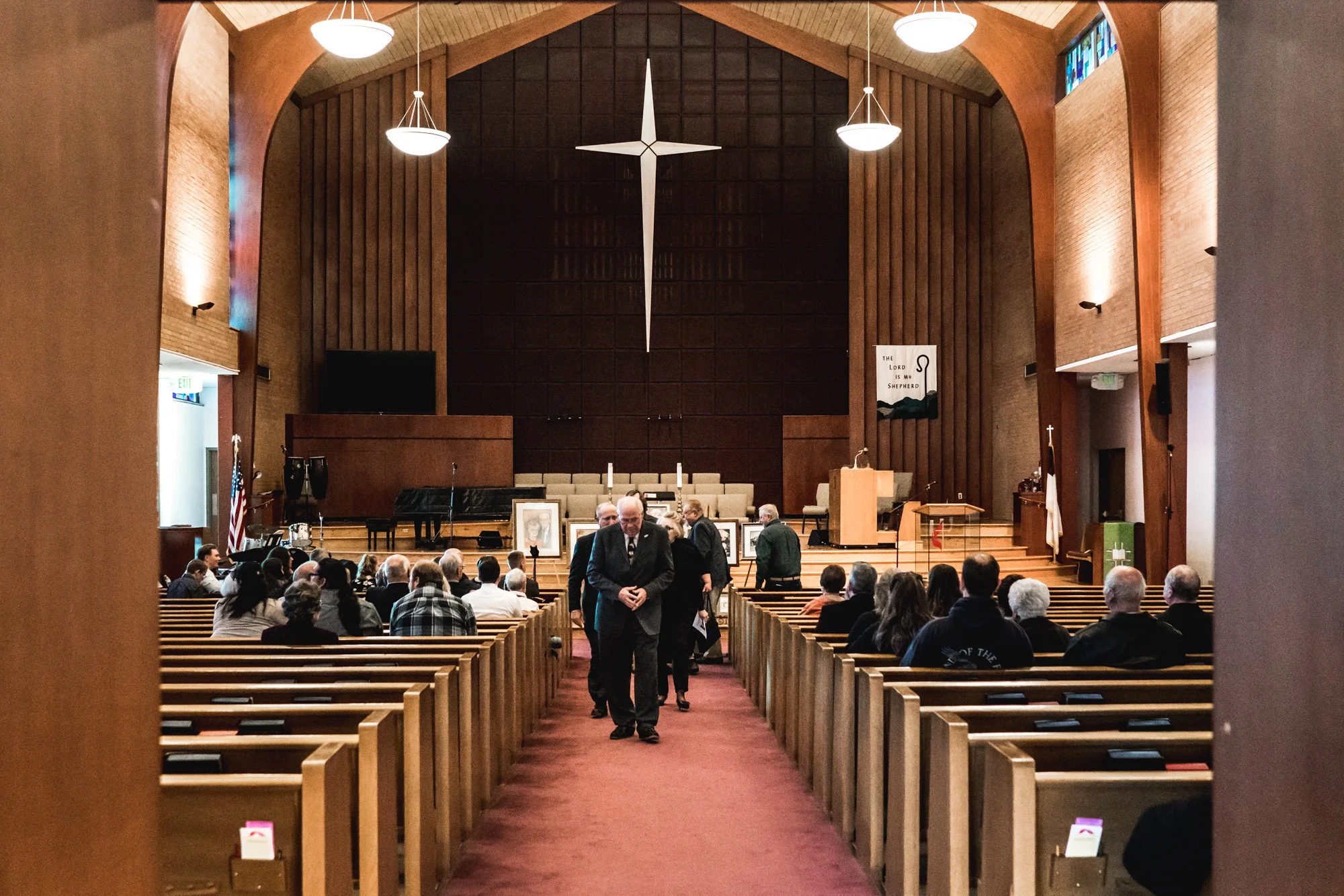 Preacher and family members walk out of the church at the end of the memorial service for Barbara Richard at the United Methodist Church in Greeley, CO