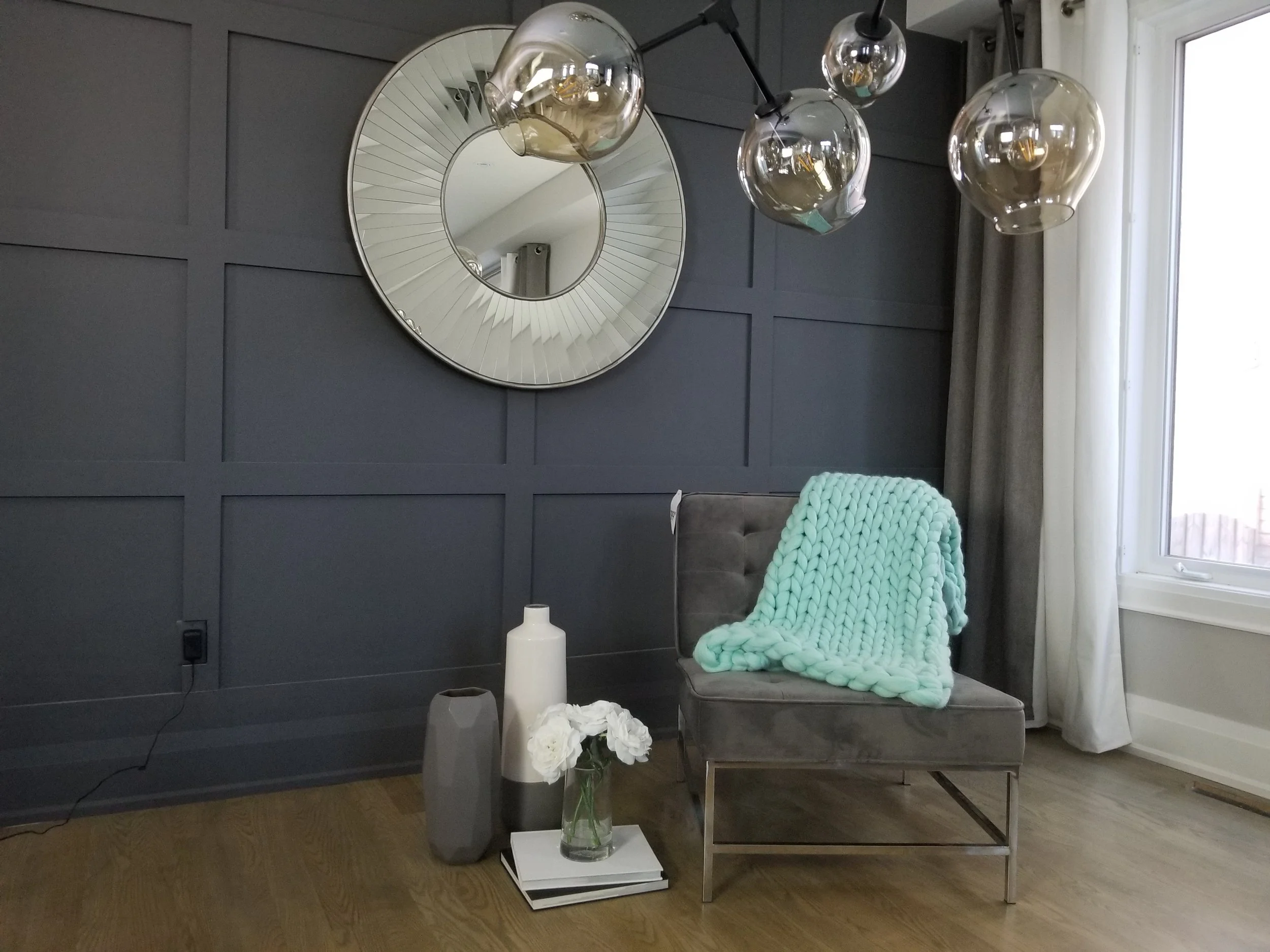 Mint chunky merino wool throw on living room reading chair