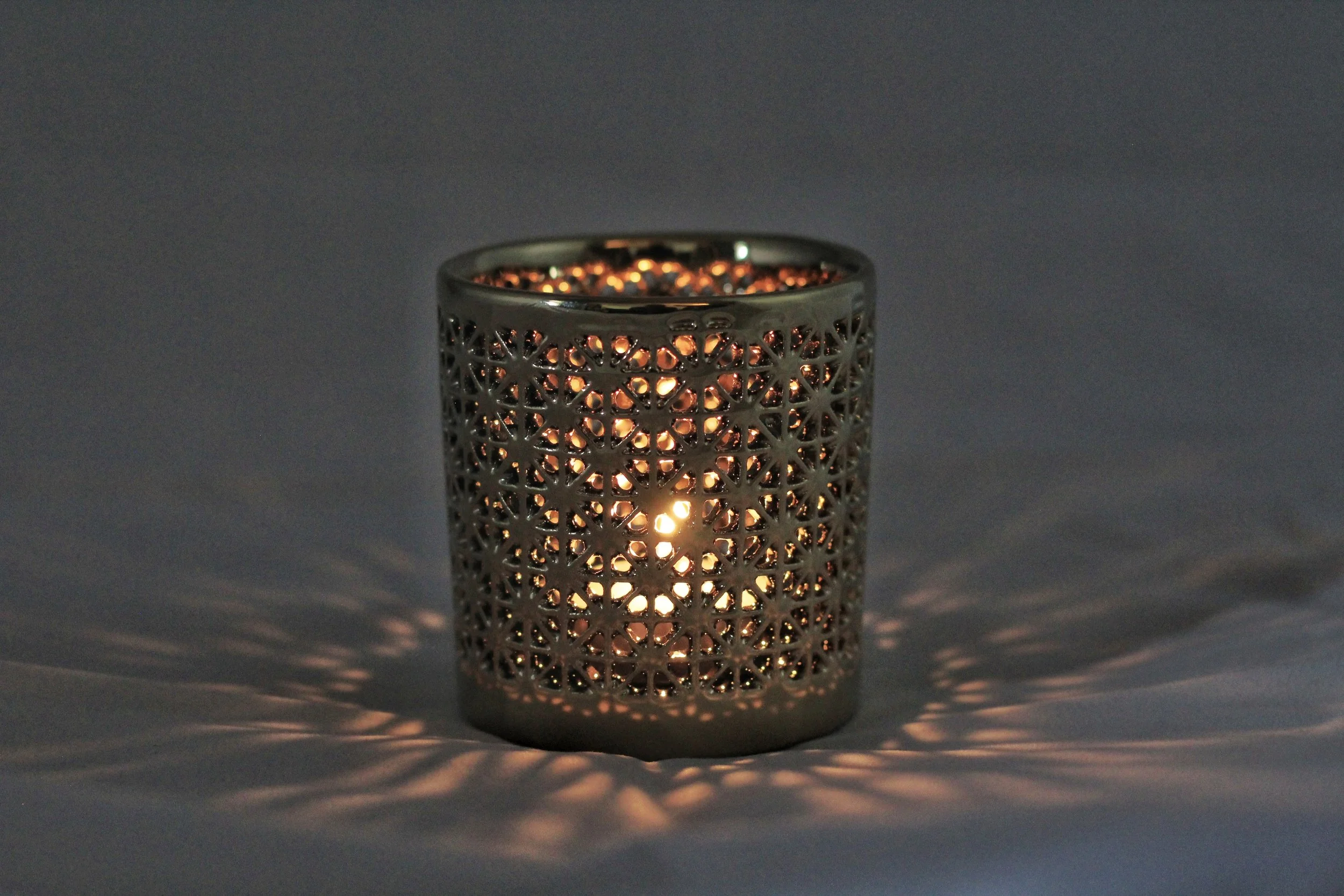Asterisk votive tea light candle lit-01.jpeg