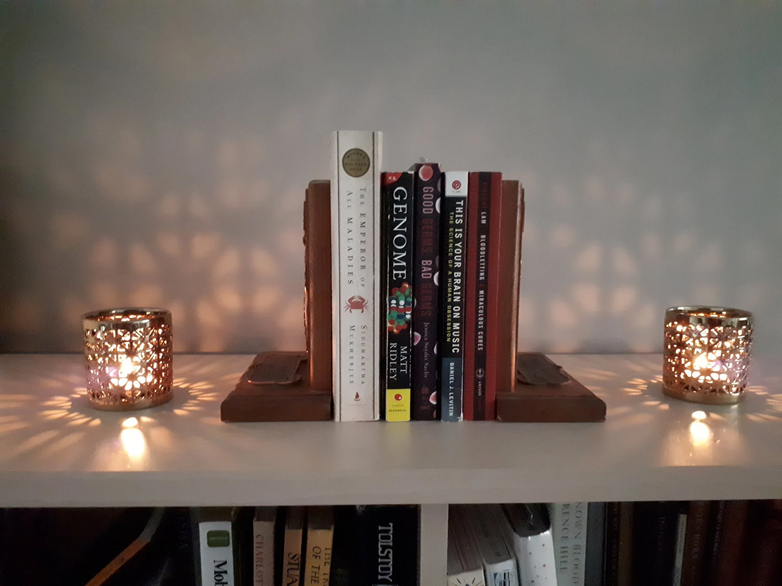 Lighting and candles can also be decorative elements, and placed to help frame things - like books! But not too close to the candles, of course.