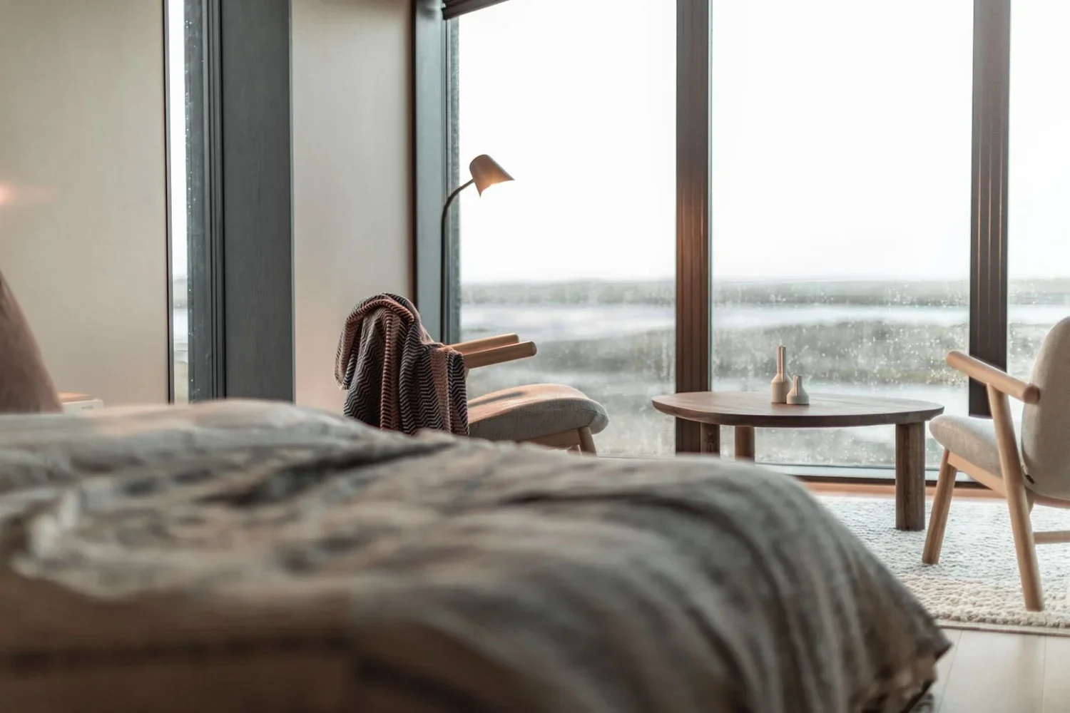 Guest cabin with panoramic window framing lake views