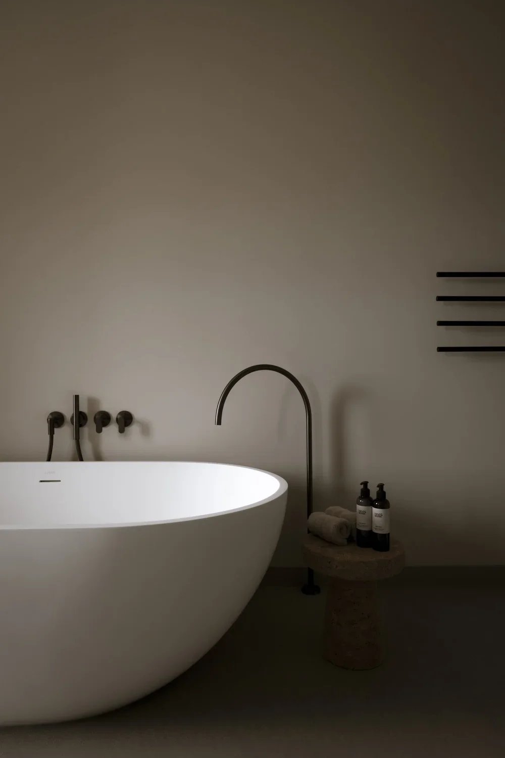Guest cabin bathroom with textured finishes and warm lighting