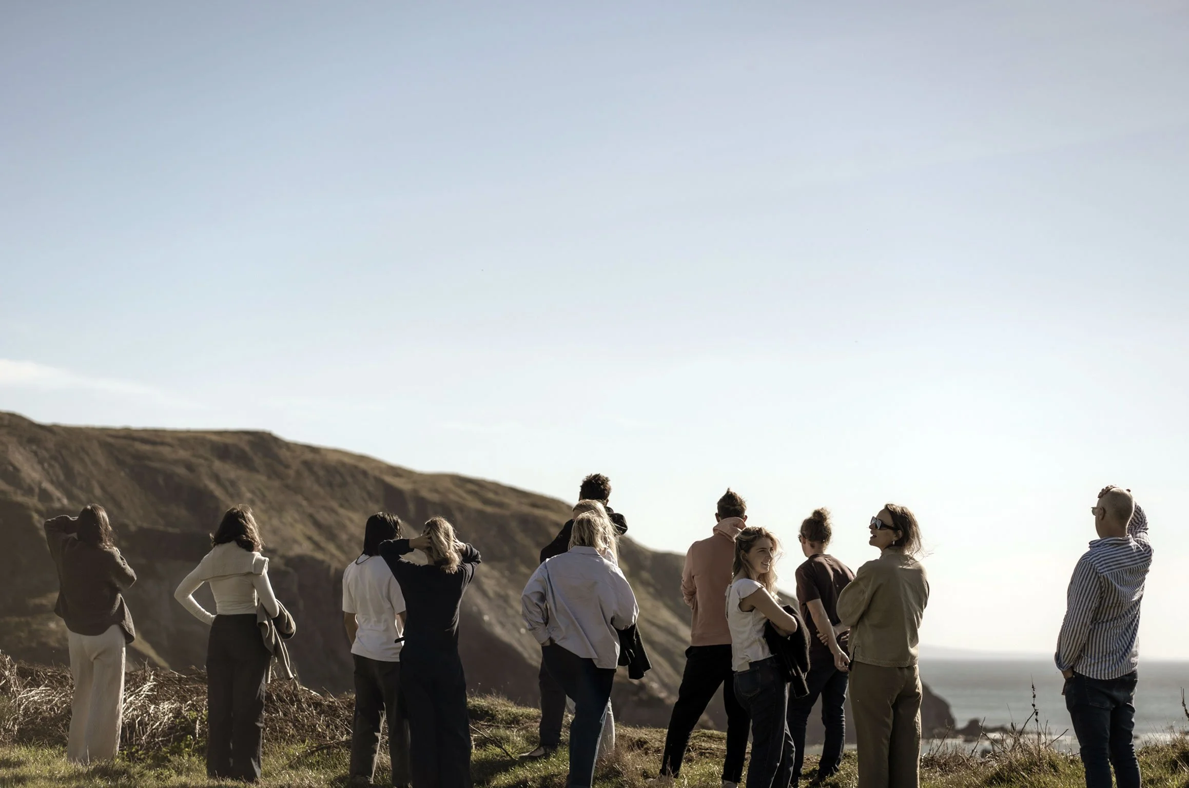 The Koto team of architects and designers looking out over the North Devon coast