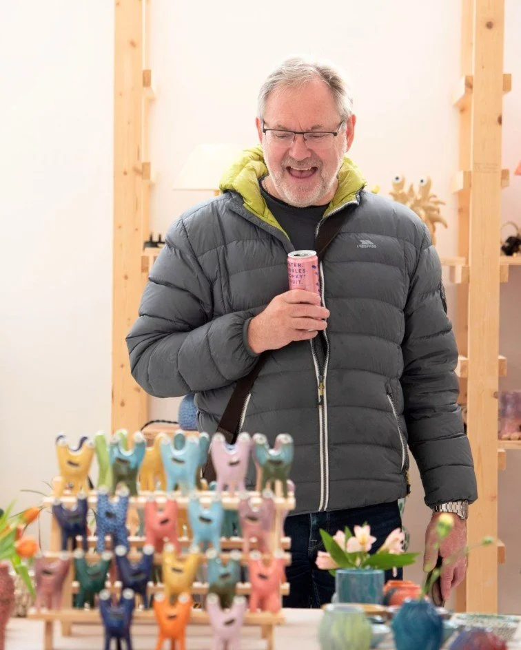 Art collector observing the ceramic pieces on exhibition
