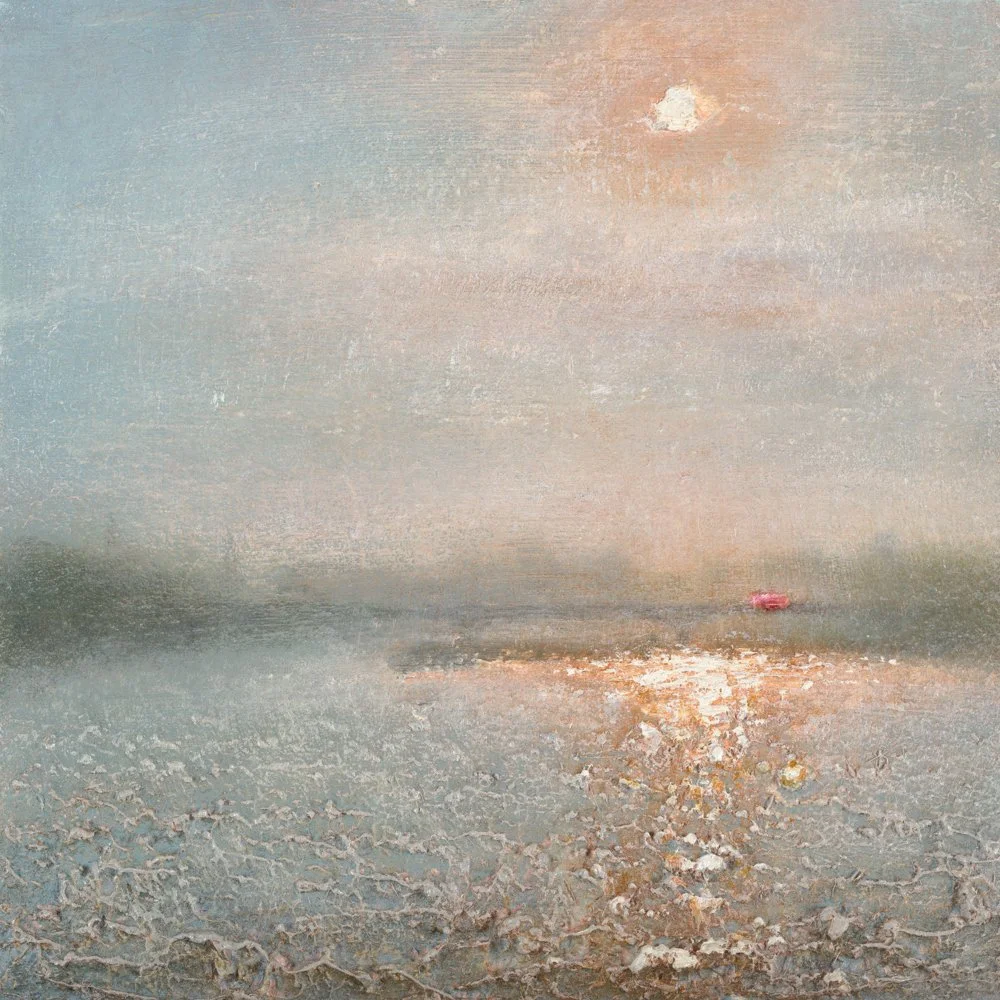 A sunset over a frozen body of water, with a partly cloudy sky and distant trees on the horizon.