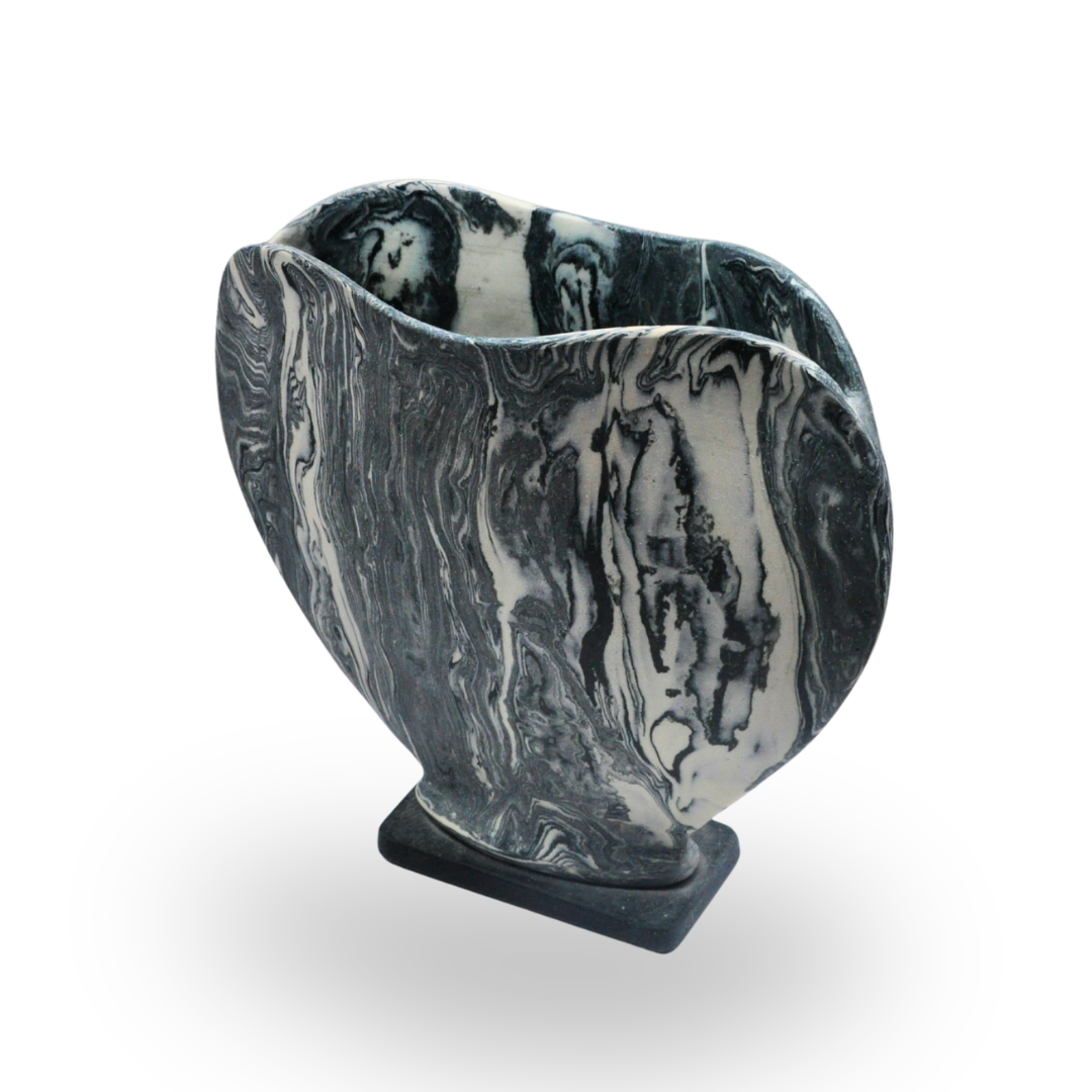 Empty ceramic plate with a scalloped edge and a textured light blue and yellow glaze.