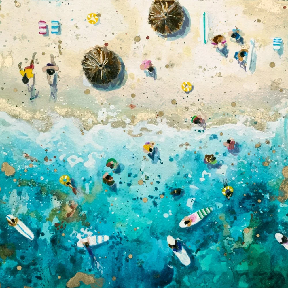 Aerial view of a crowded beach with people swimming, surfing, and relaxing on loungers on sandy shore and turquoise water.