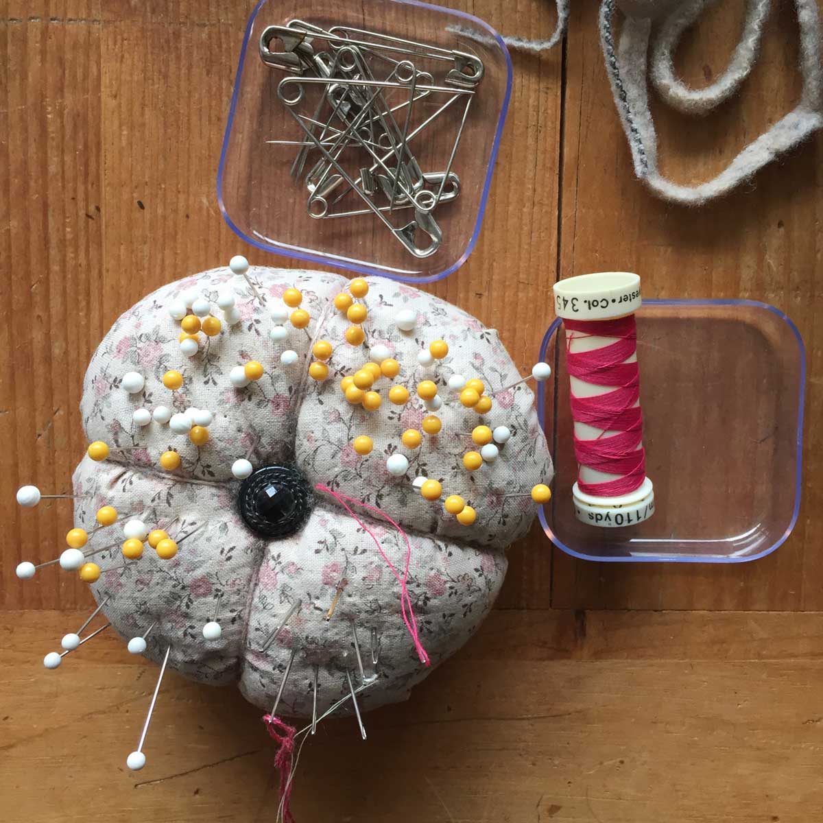 pin cushion, thread and pins for making hooked rugs