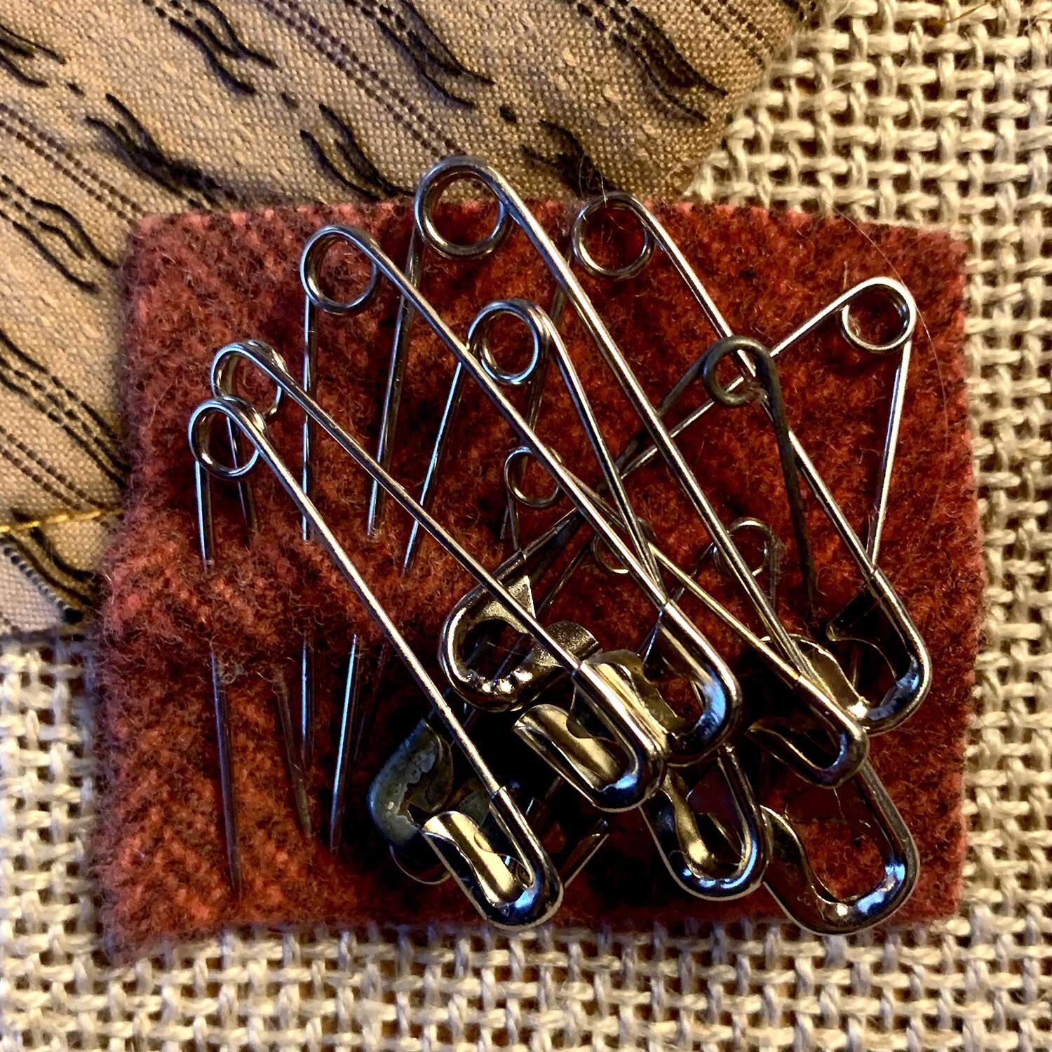 safety pins stored on a bit of wool