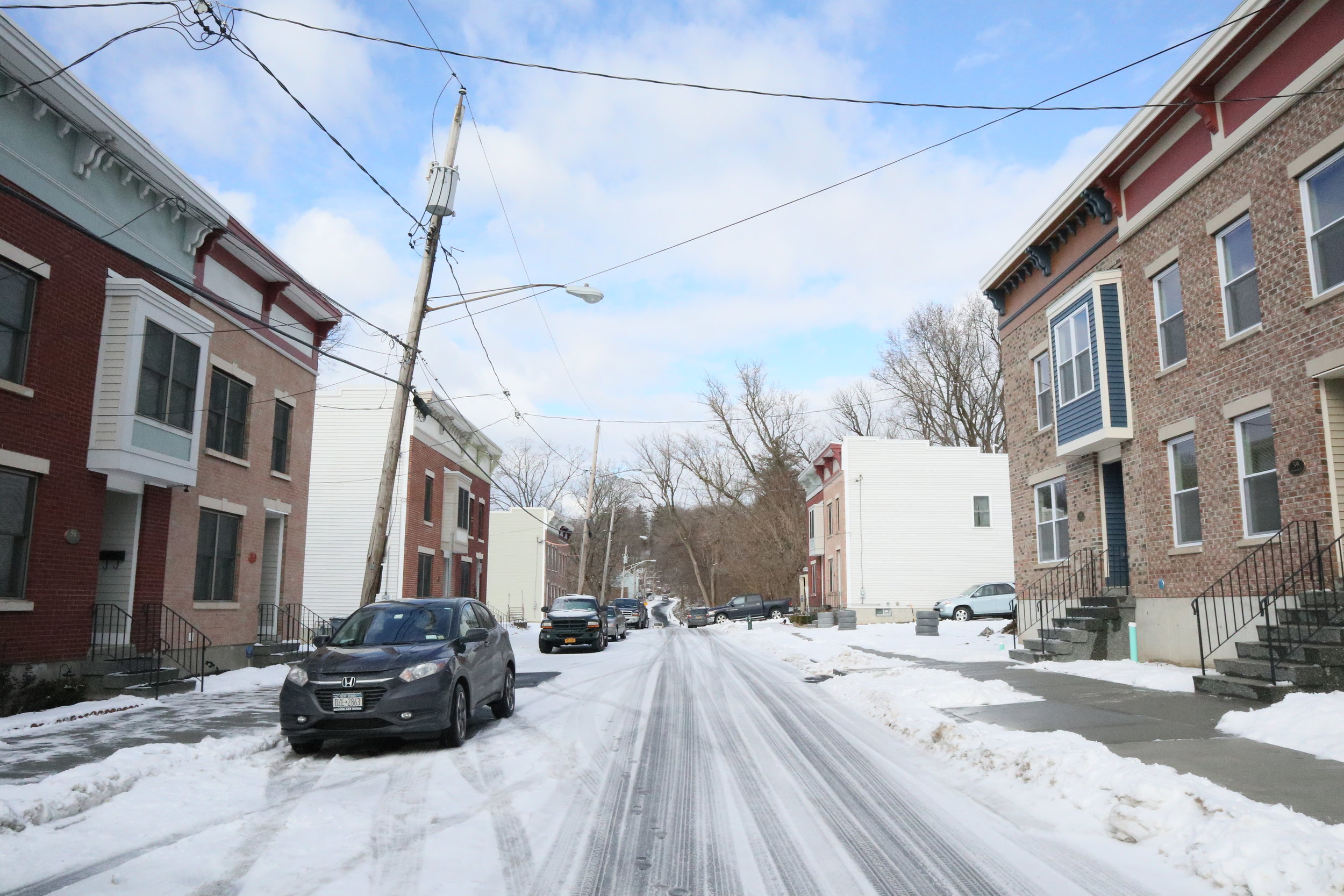 Three sets of attached row houses in Albany’s South End neighborhood.
