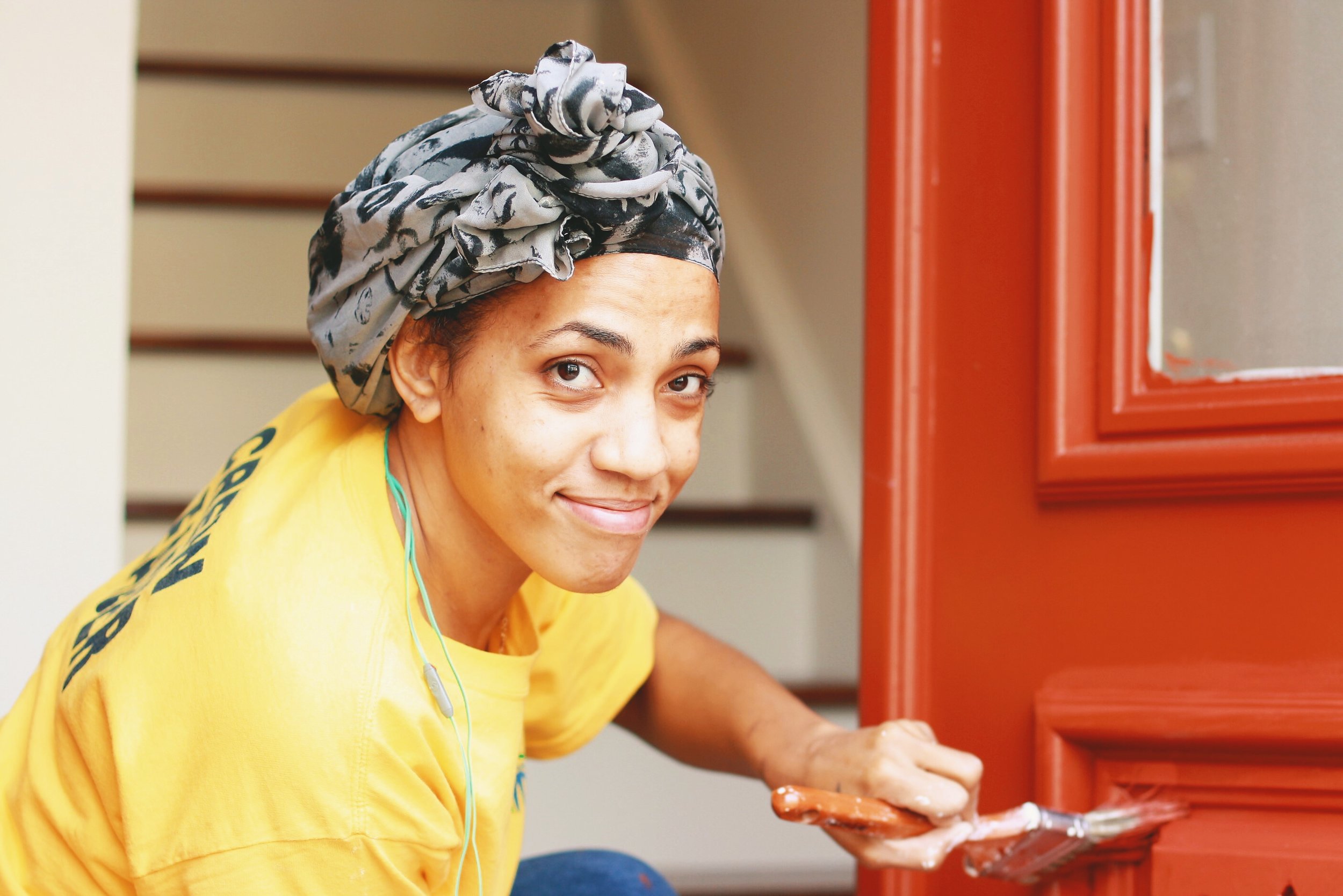 Vanessa painting a door. We love this picture!