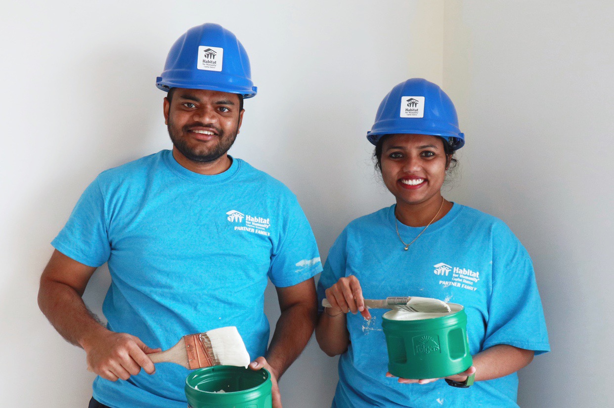 South Troy homeowners pose while completing sweat equity at their home!
