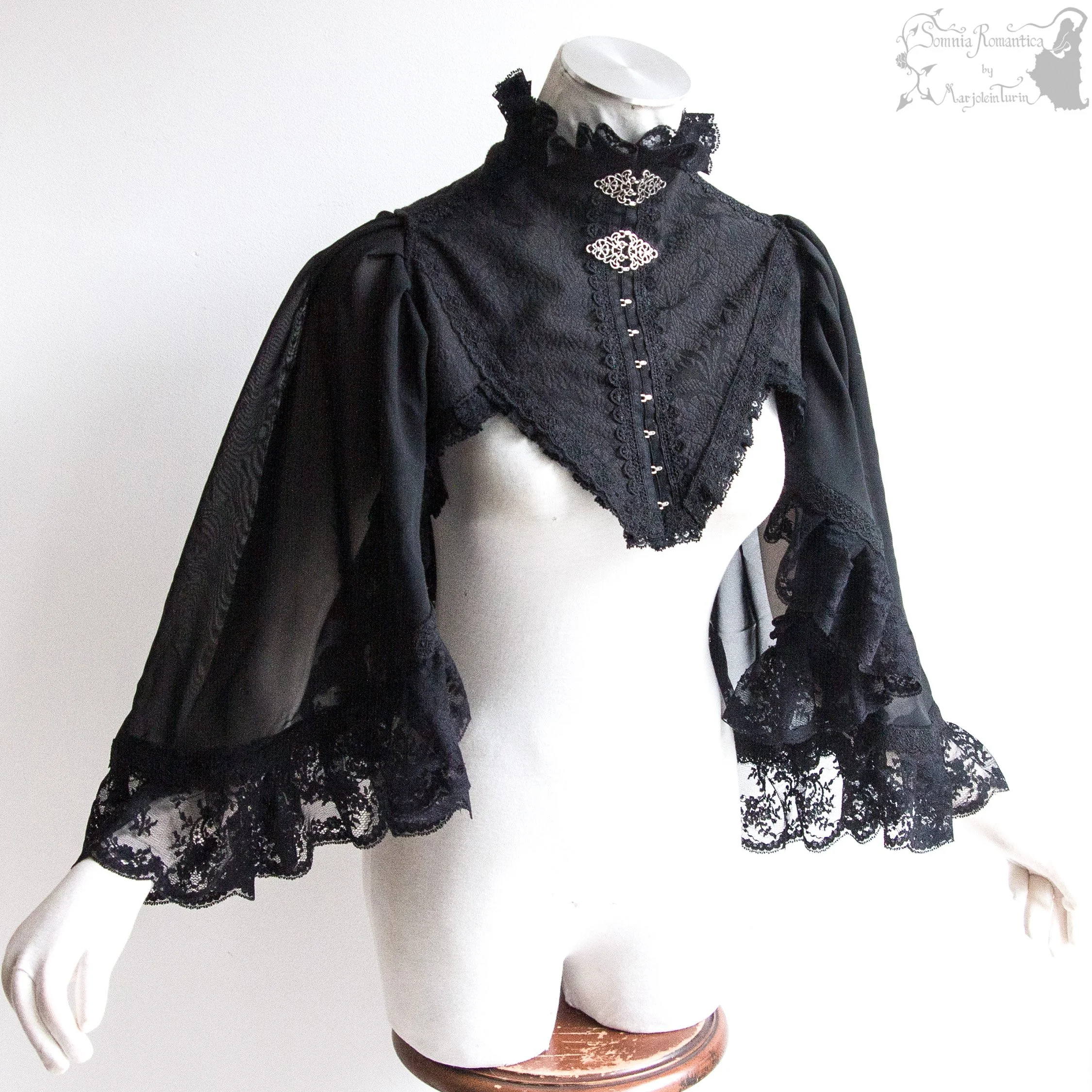 Cape shrug black M-XL, sundry designs 2025