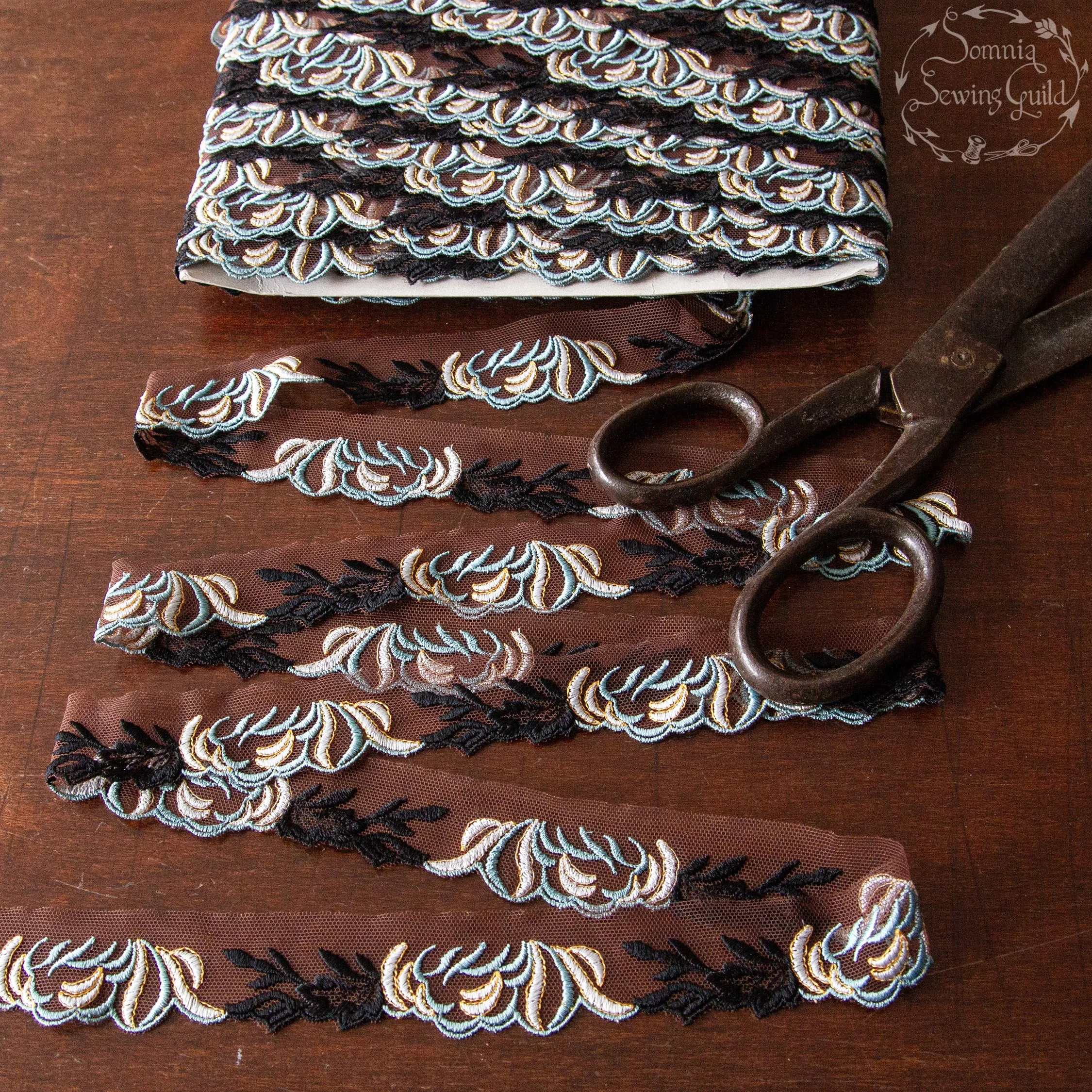 11 yards (10 meter), emroidery on brown mesh, 1 1/4 inch wide (3 cm)