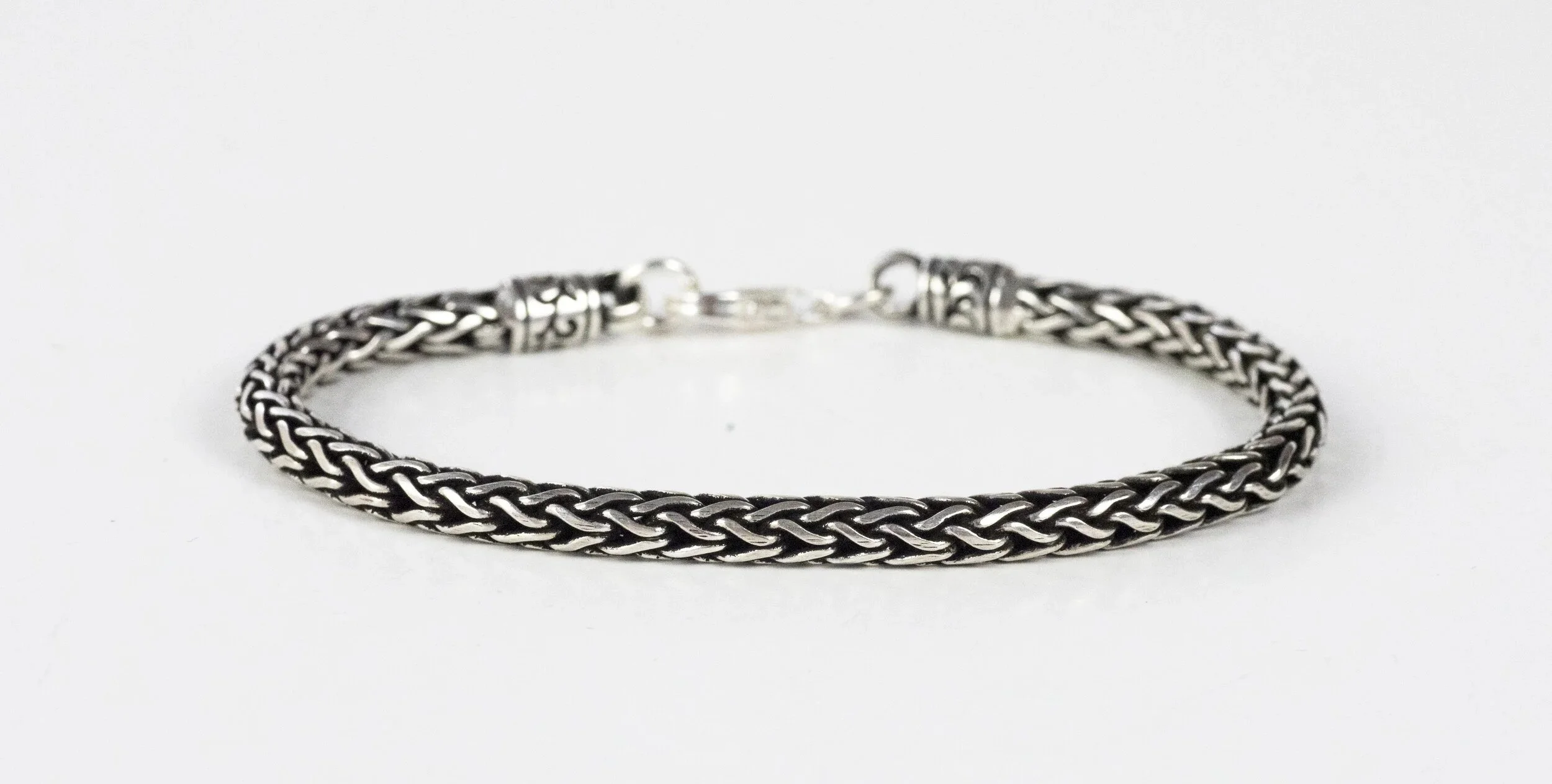 silver-woven-snake-bracelet-flat-lay.jpg