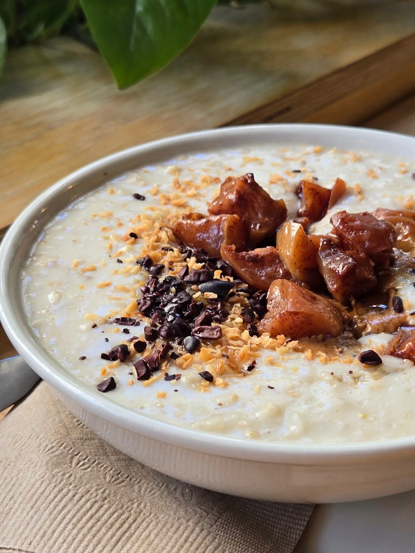 🍂Cool fall mornings call for something warm and comforting ✨️🤭

Our Porridge is the perfect start &mdash; topped with Almond Butter, Roasted Apples, Coconut, and Cocoa Nibs. 🍎🥥
It&rsquo;s cozy, nourishing, and full of those fall feels.

Are you c
