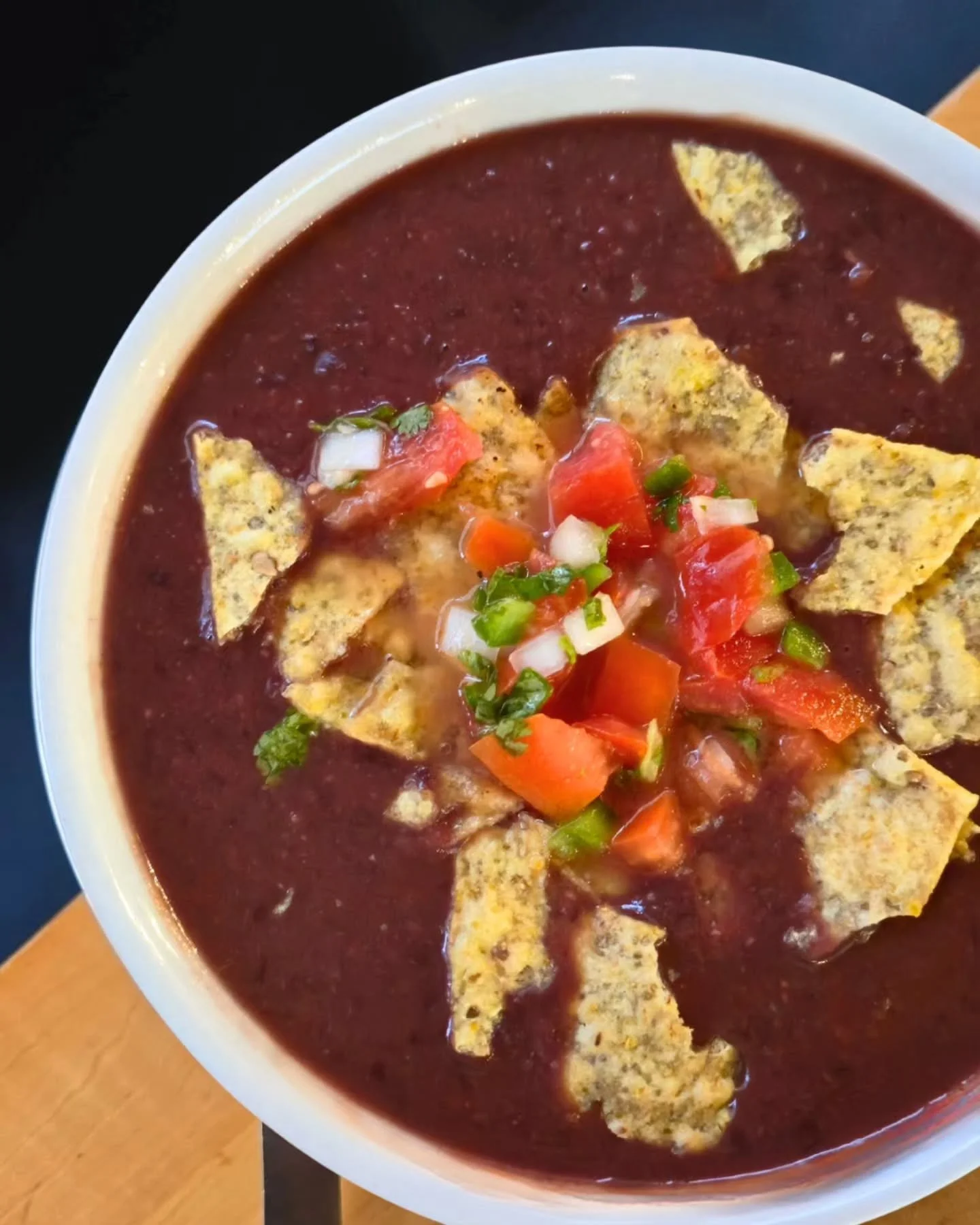 Warm up with our Smokey Black Bean Soup! 🌱🫘

⚠️Vegan, gluten-free, and seriously packed with flavor. Topped with fresh &quot;Pico BE Gallo&quot; and crispy corn chips &mdash; because a little crunch makes everything better.🙏

Have it solo or go al