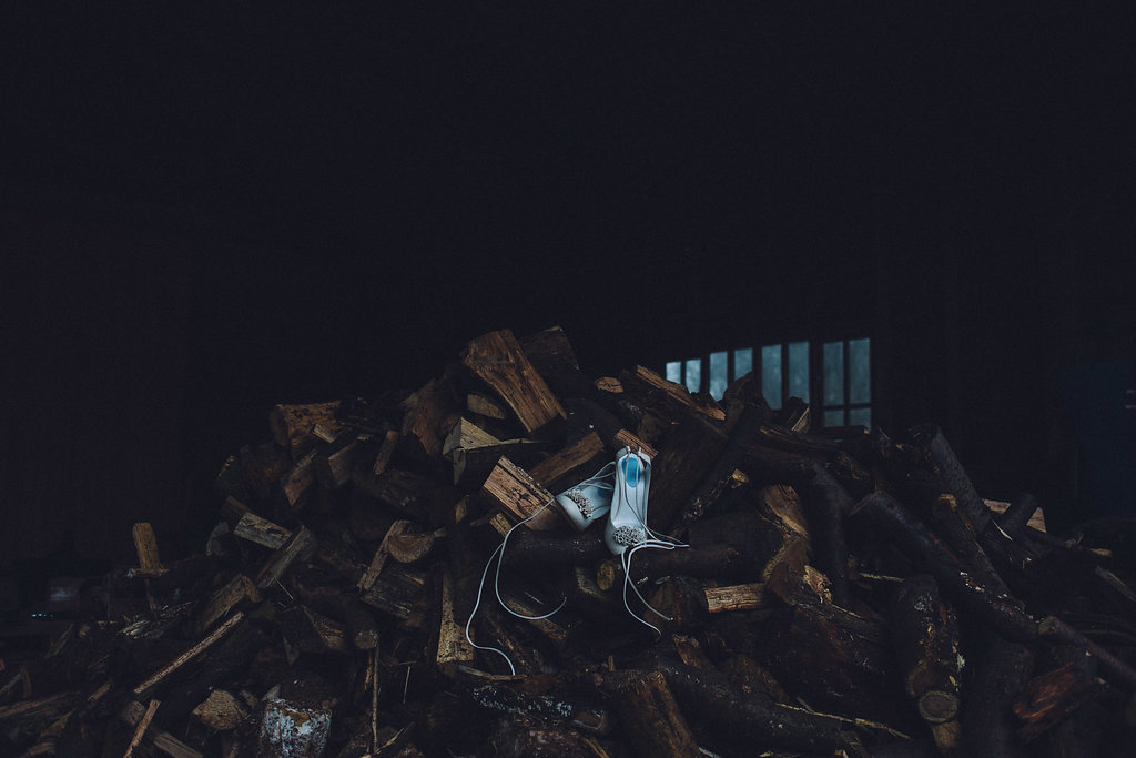 Shoes on Wood Log Stack - Captains Wood Barn Essex