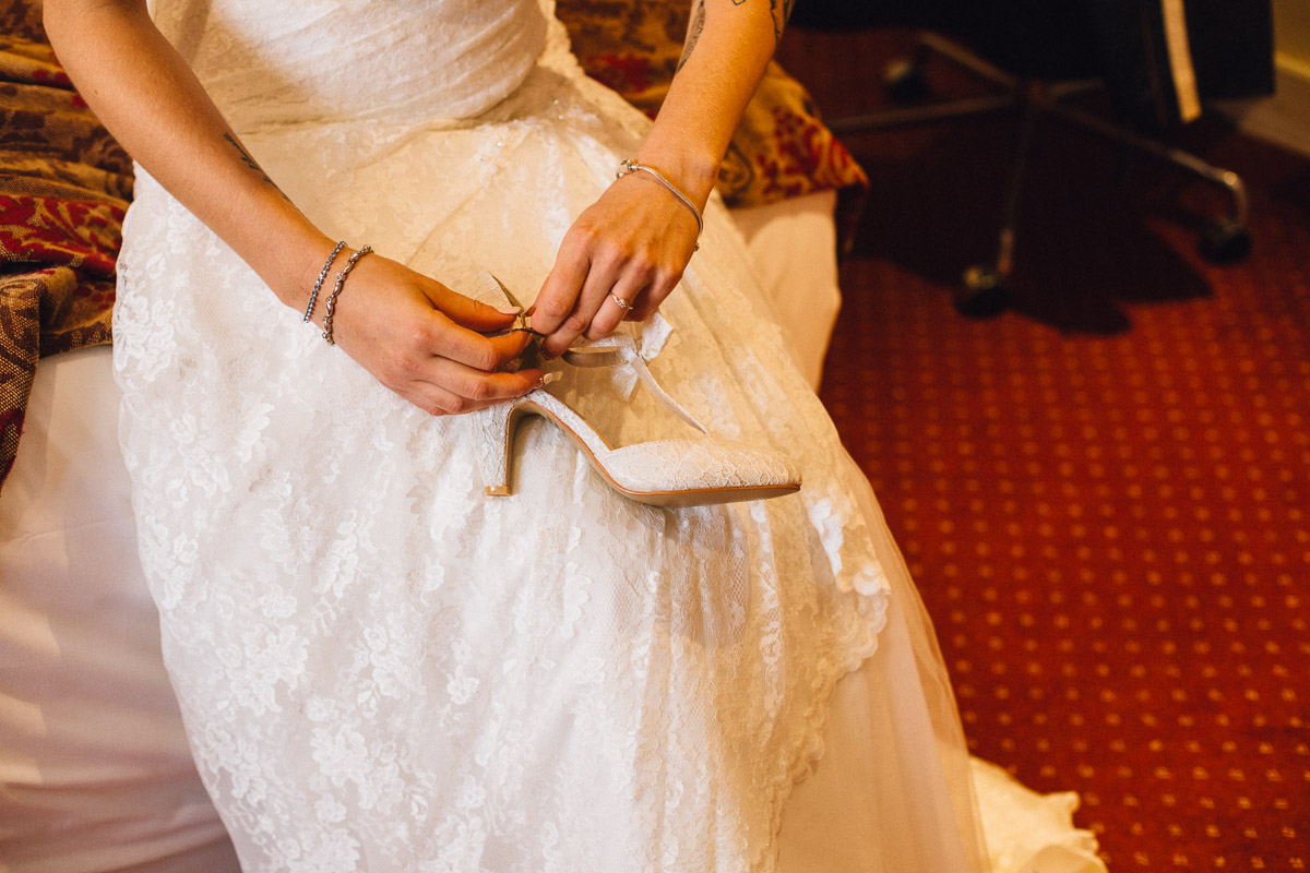 Bride Putting Shoes On