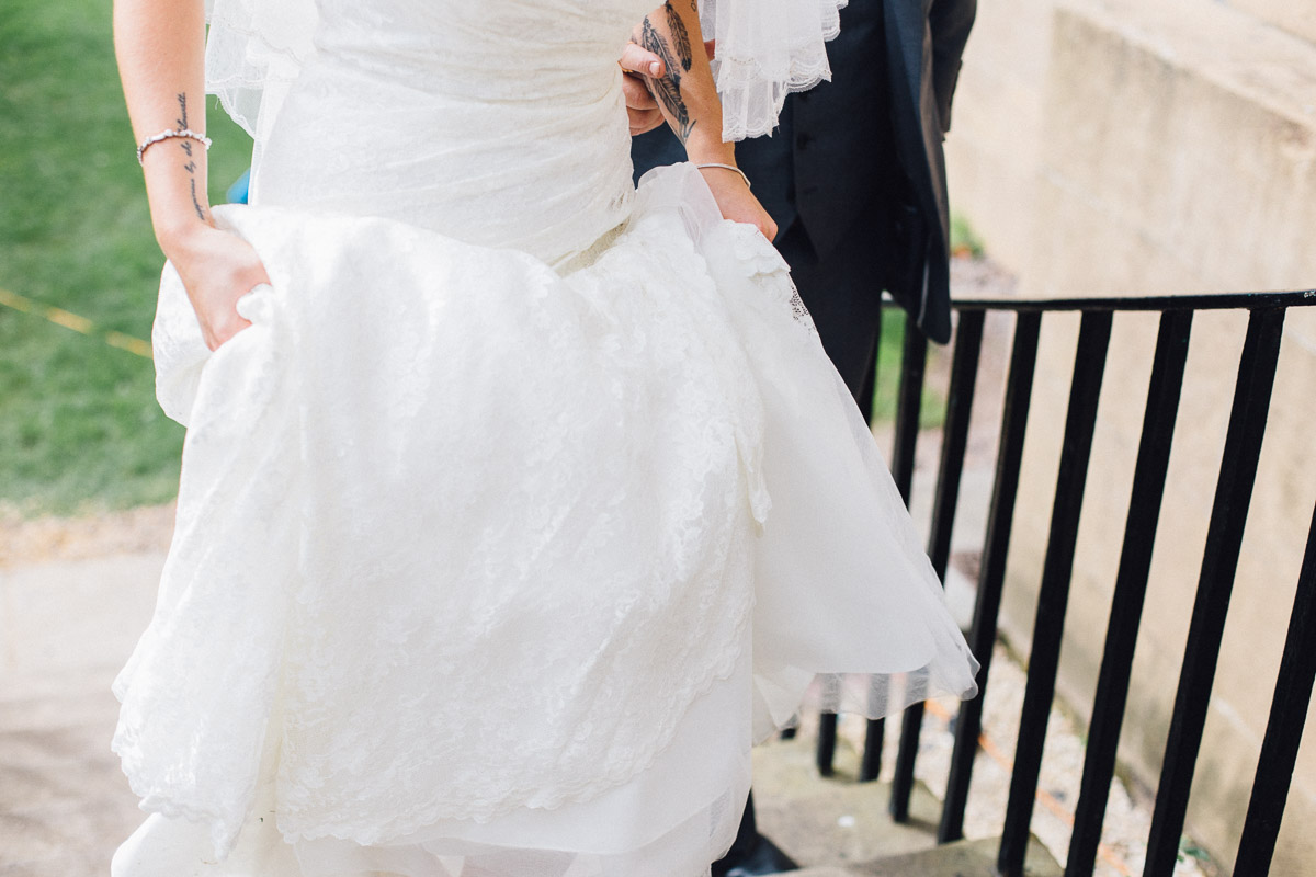 Bride Walking up Steps to Wedding Venue