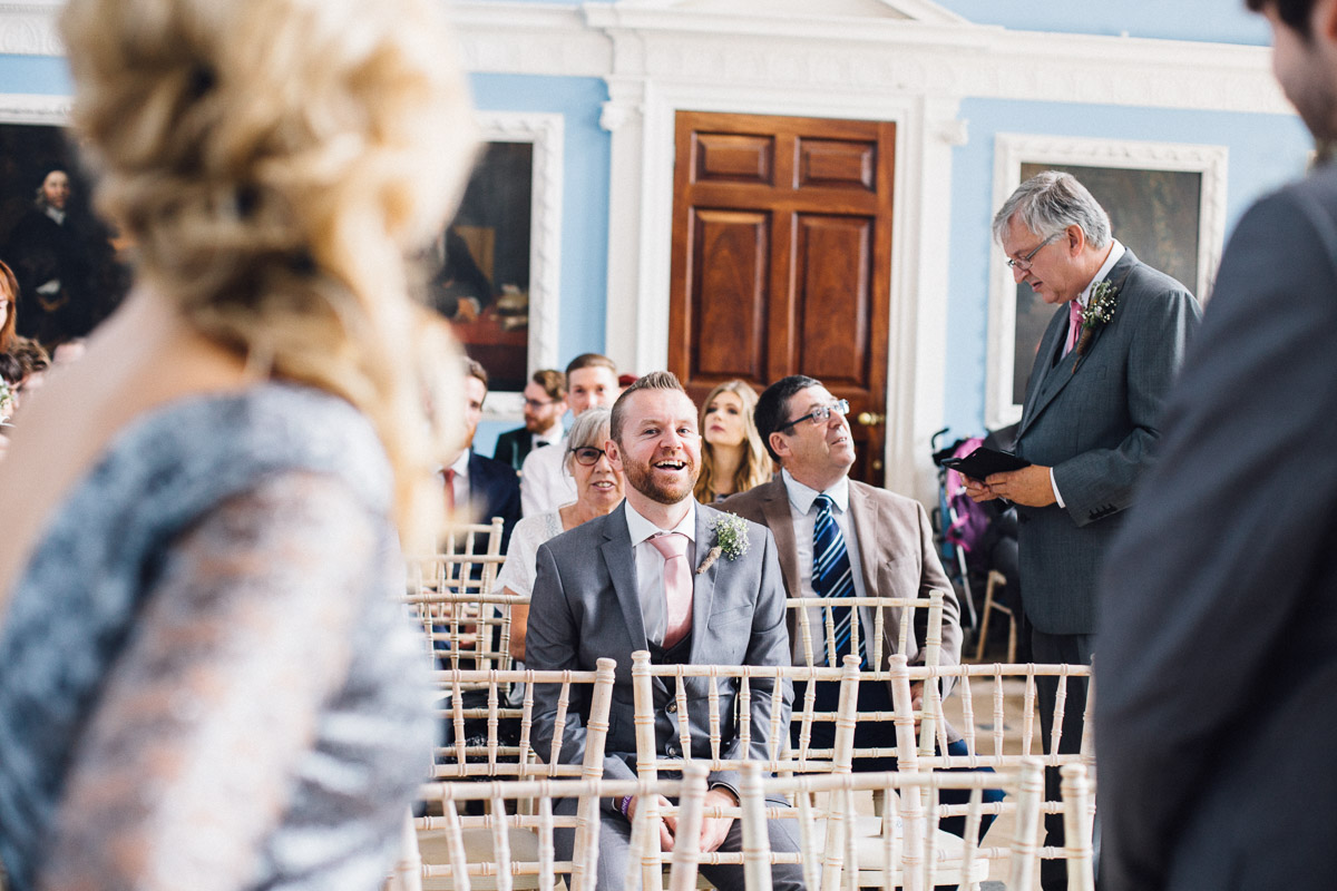 Guests Laughing waiting for Wedding Ceremony