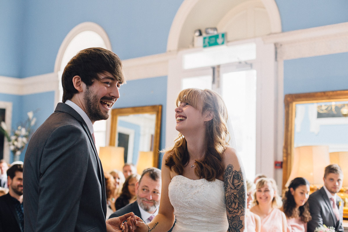 Bride and Groom Laughing During Ceremony