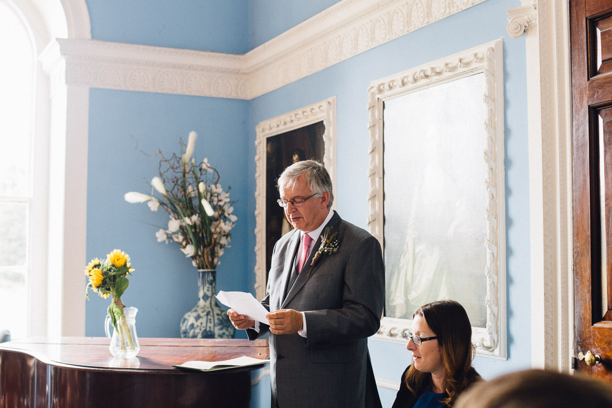 Father of Groom doing Reading During Wedding Ceremony