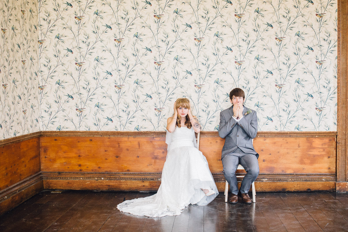 Bride and Groom Cover Faces for Alternative Wedding Photo