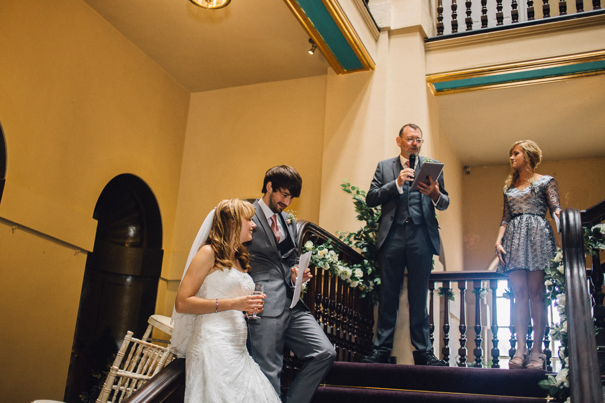 Bride and Groom During Wedding Speeches on Stairs