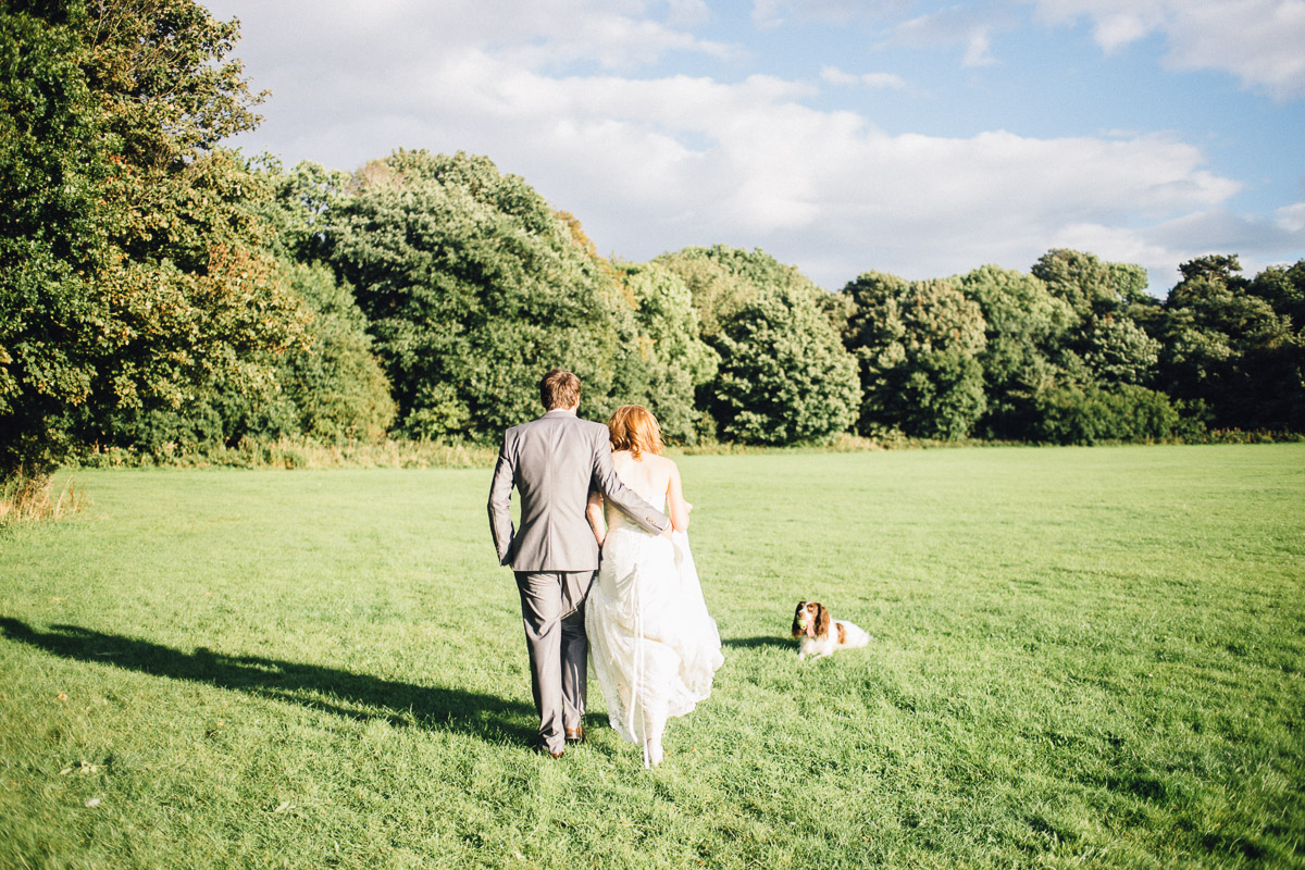 Bride and Groom Walk in Sun for Couple Portraits