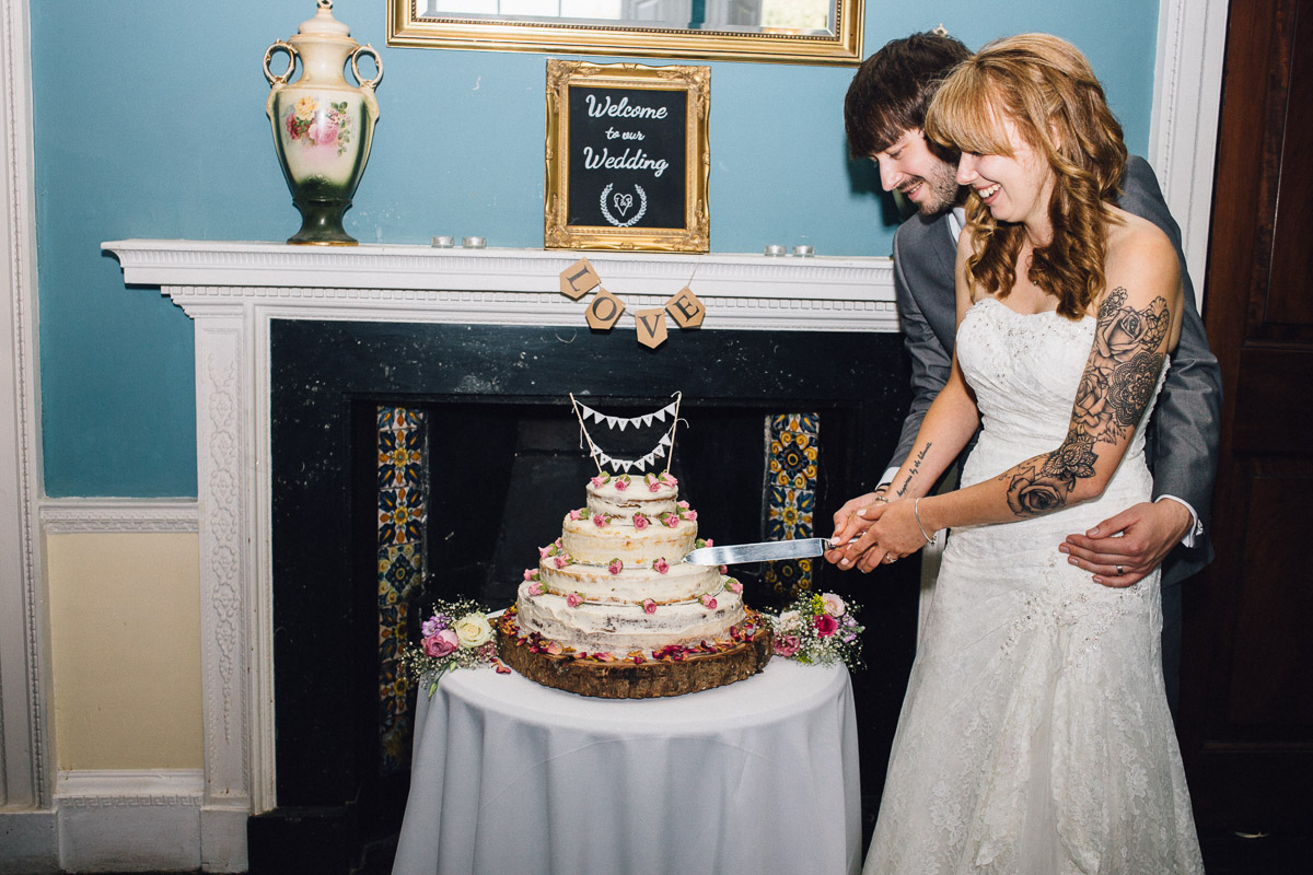 Bride and Groom Cutting Cake