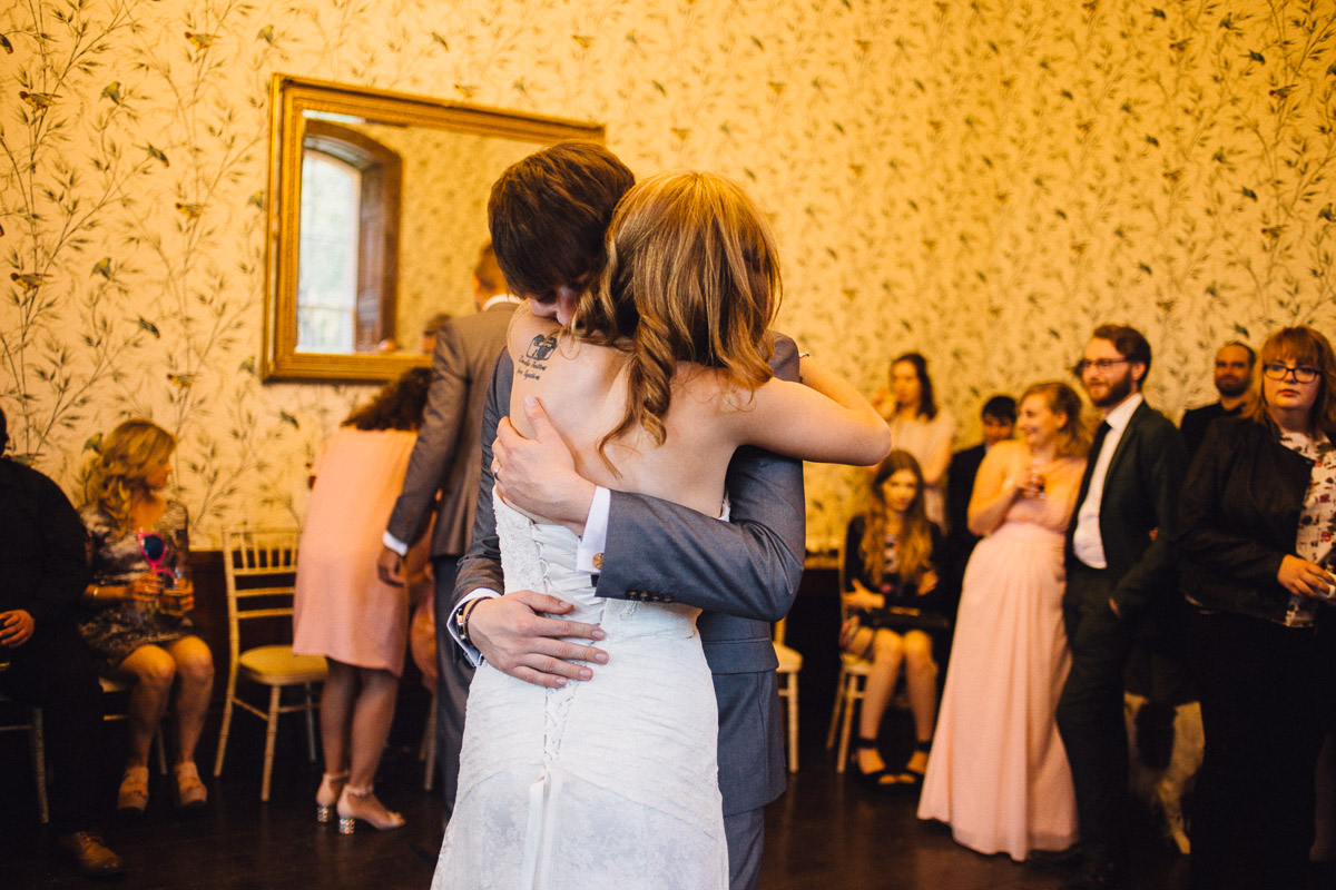Bride and Groom Hug During First Dance