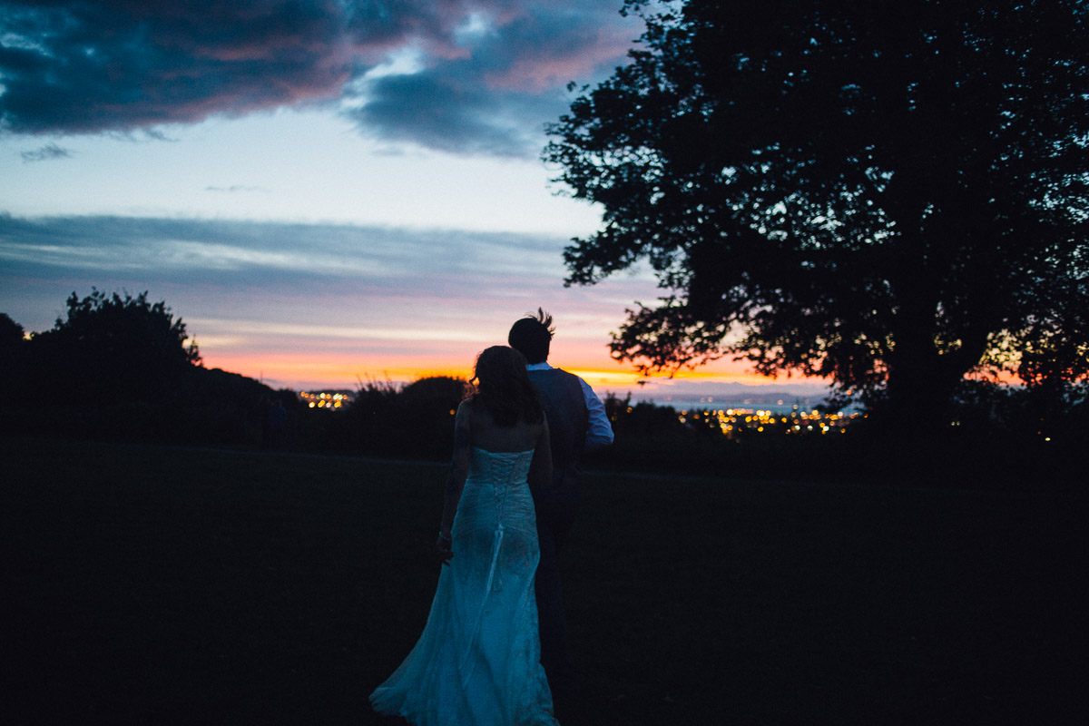 Bride and Groom Watch Sunset