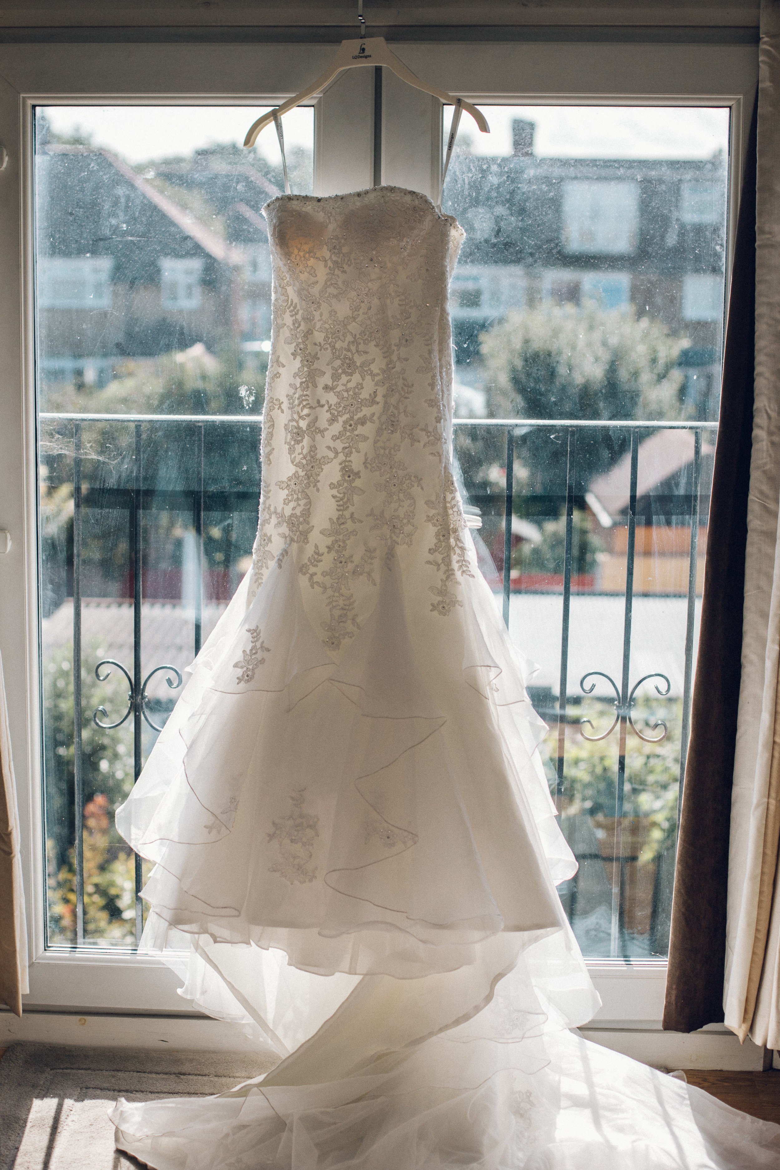 Lace wedding dress hung up
