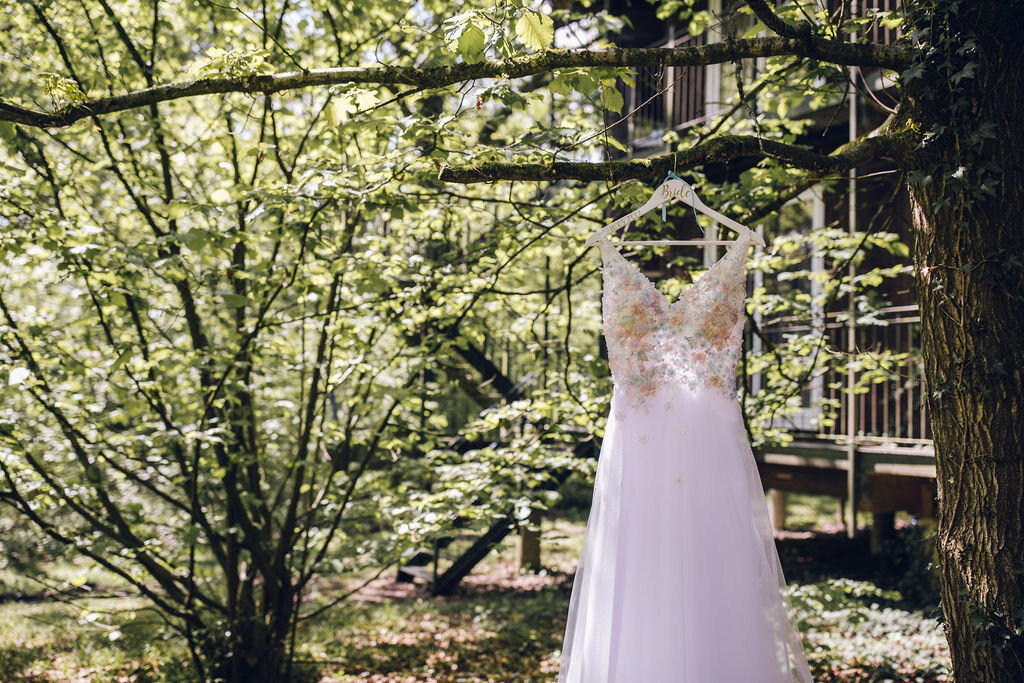 Alternative Wedding Dress Hanging in TreesColourful Retro Toy Themed Wedding, East Horton - Paige Joanna Rock n Roll Bride