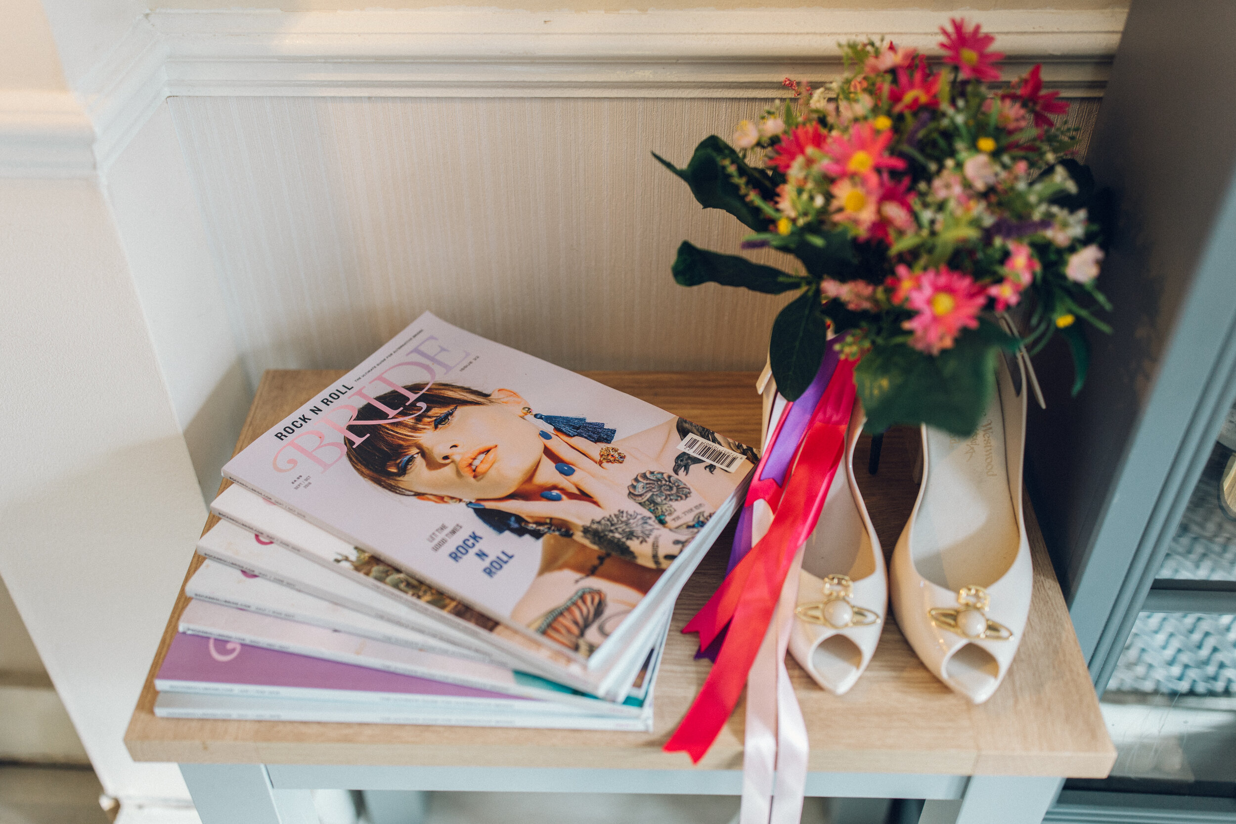Rock n Roll Bride Magazines with Shoes and Bouquet 