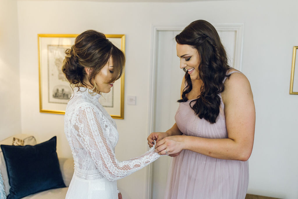 Relaxed Wedding at the Dreys, Kent - Bride Putting Dress On