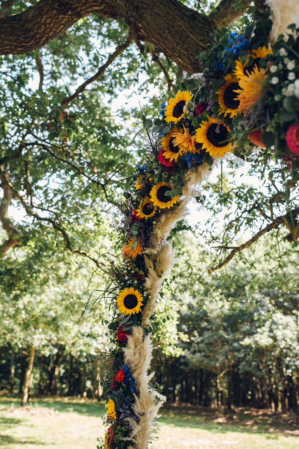 Colourful Festival Wedding Essex - Bright Floral Hoop Ceremony Backdrop