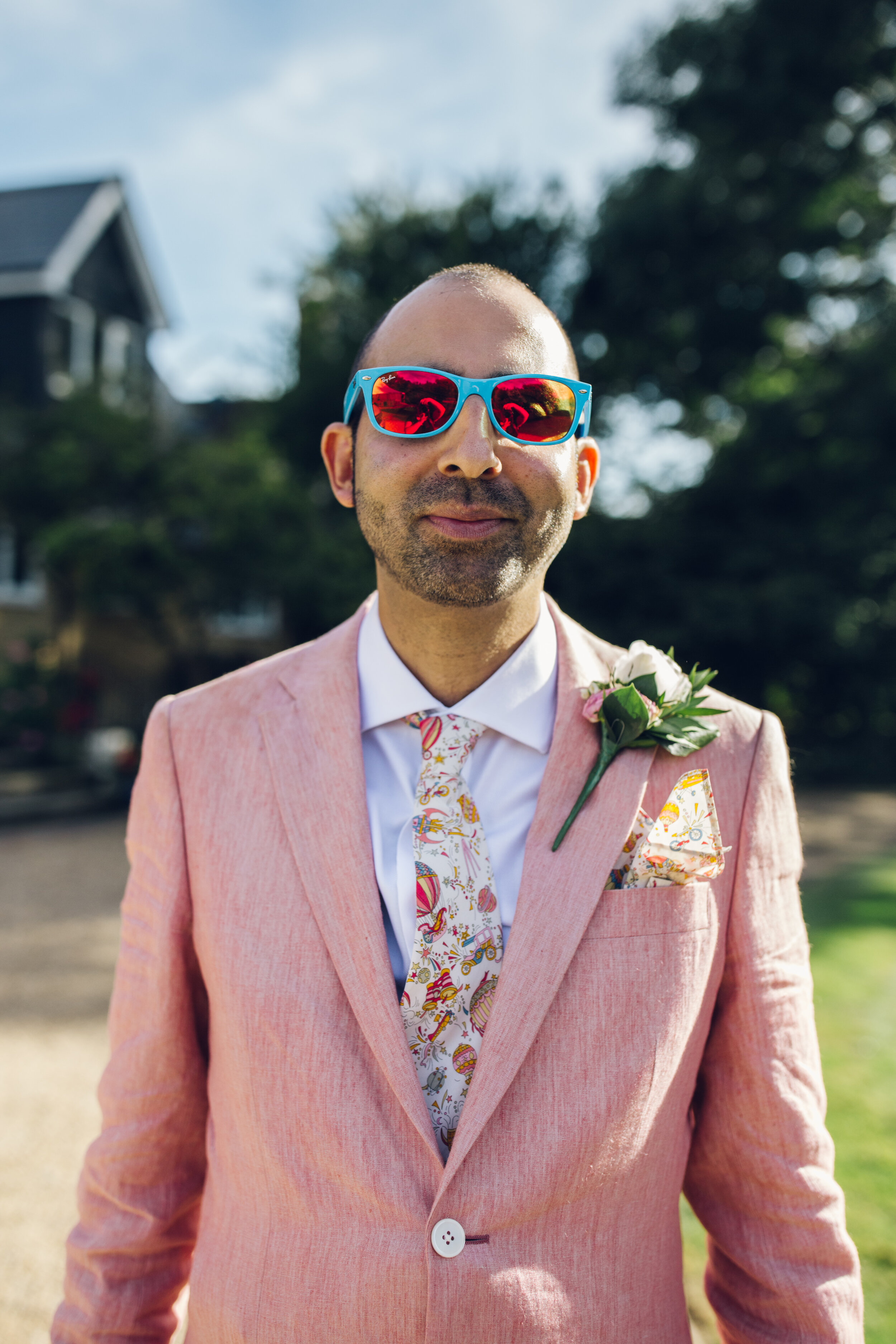 Colourful Wedding Photography - Groom Wearing Pink Suit