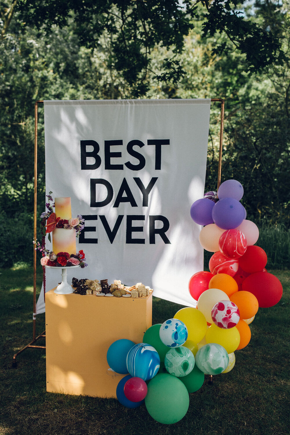 Colourful Boho Wedding Photography -Browning Bros Essex Festival Wedding Balloon Arch