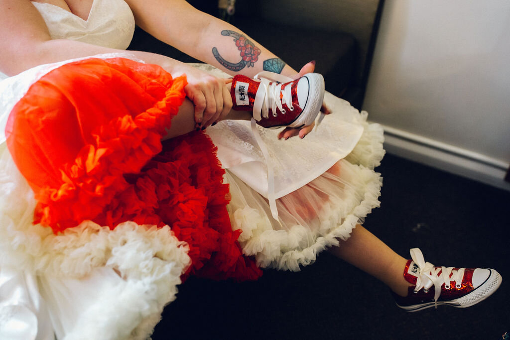 Red wedding converse with 50's dress - Intimate Essex wedding Old Parish Rooms