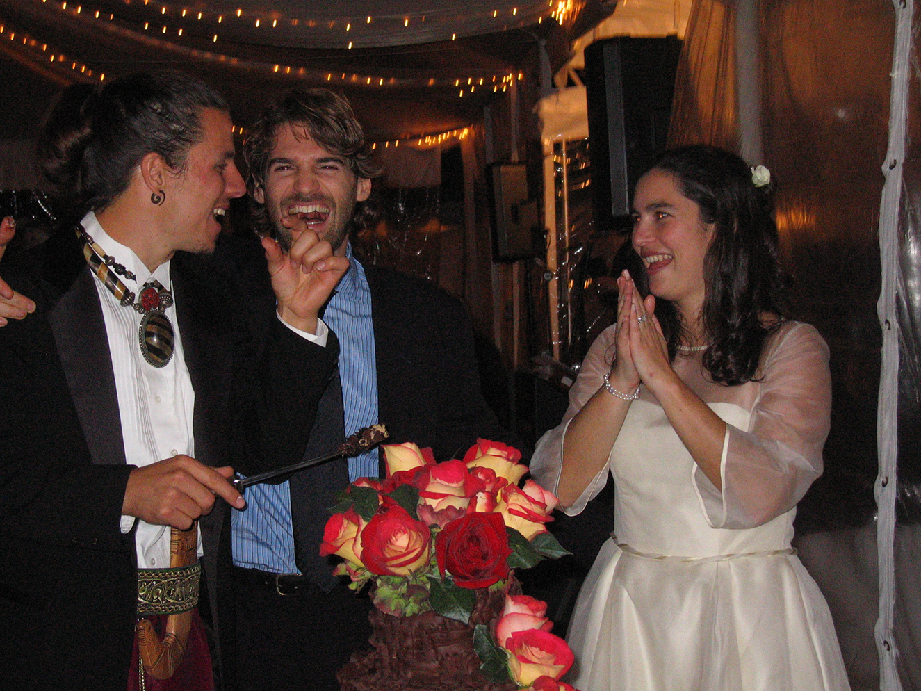 Our wedding, with best man Roko, in Westchester, New York. To cut the cake, he used a Yemeni dagger I gave him after his dad disappeared