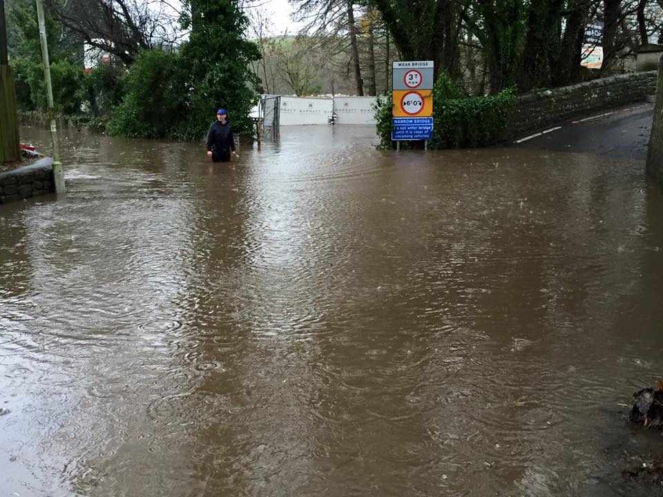 Flooding at the Halton entry to Denny Beck Bridge, caused by storm Desmond in 2015, Photo by Rebecca Mitchell, posted to Lancaster Past & Present on Facebook.