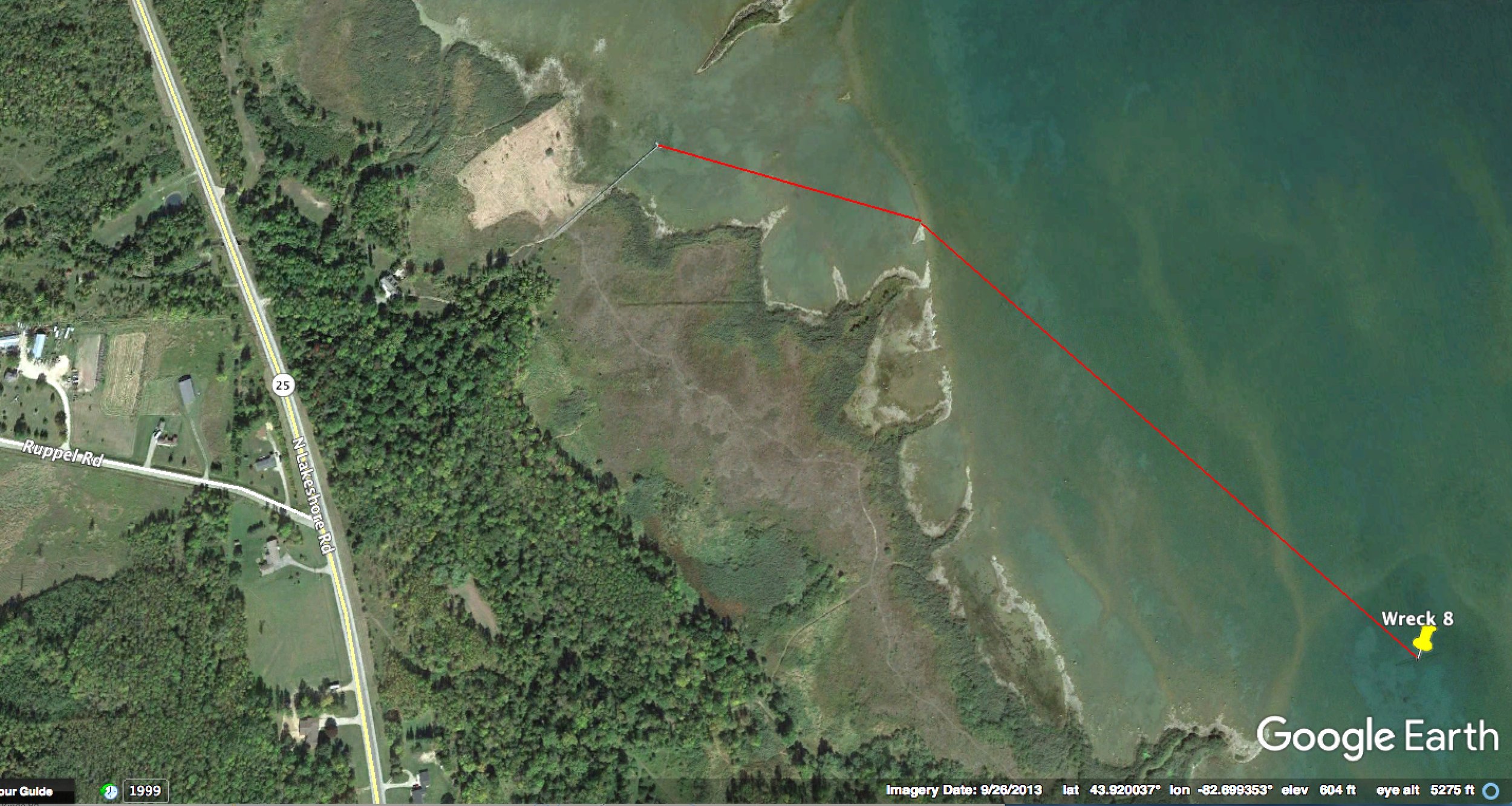 Wreck is 1,300 ft. from shore on bearings of 107 and 134 degrees. Shore access may be only through private driveways or trails from M-25. Please respect private property.