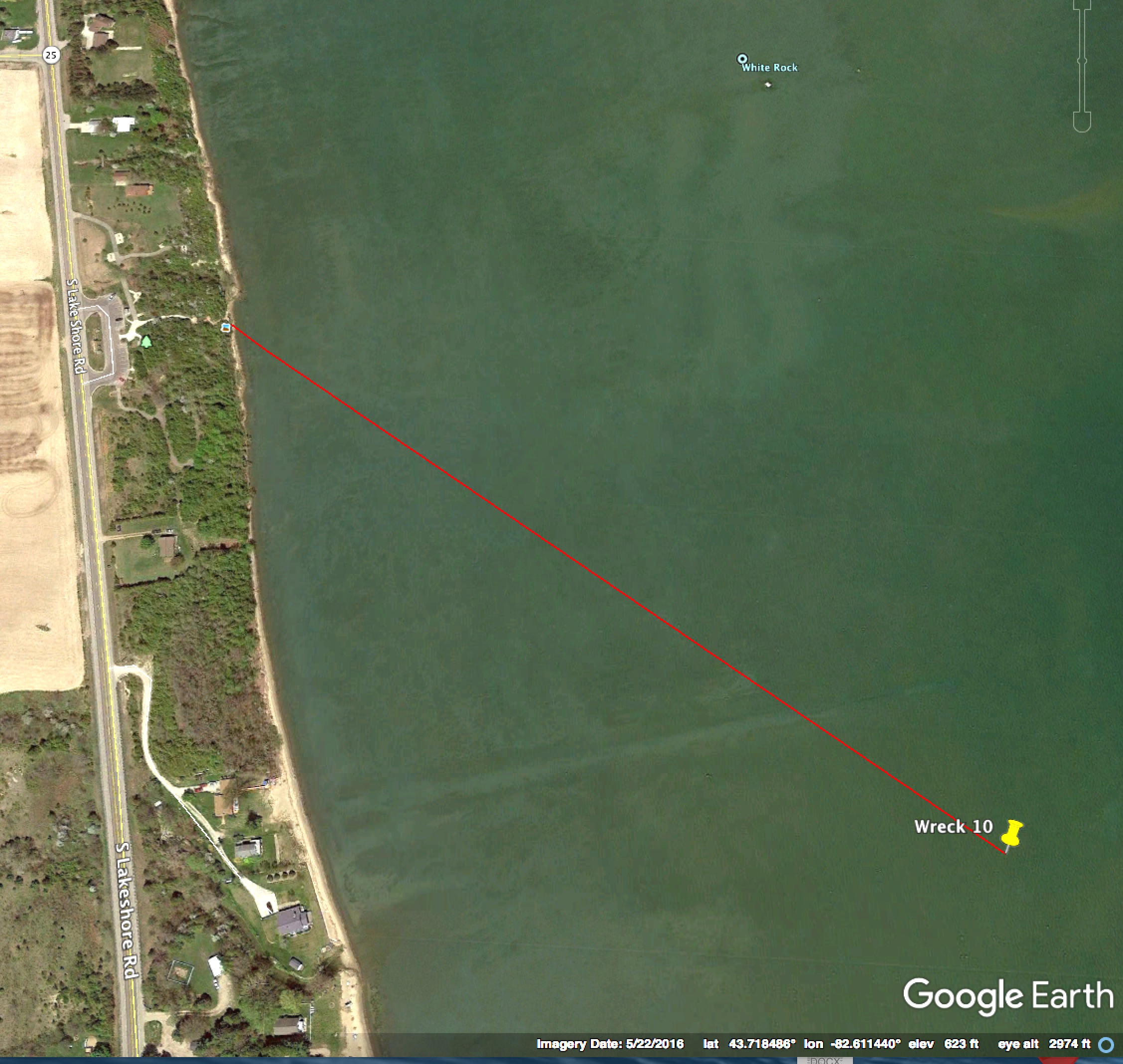 Wreck is 1,900 ft. from shore on a bearing of 126 degrees. Public access at the White Rock parking area off M-25.