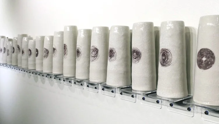   Quiet Witness: Mapping Transient Chaos (34 minutes) and the effect on the butterfly.  Porcelain, translucent crackle glaze and decal; 11 x 170 x 4 in. 